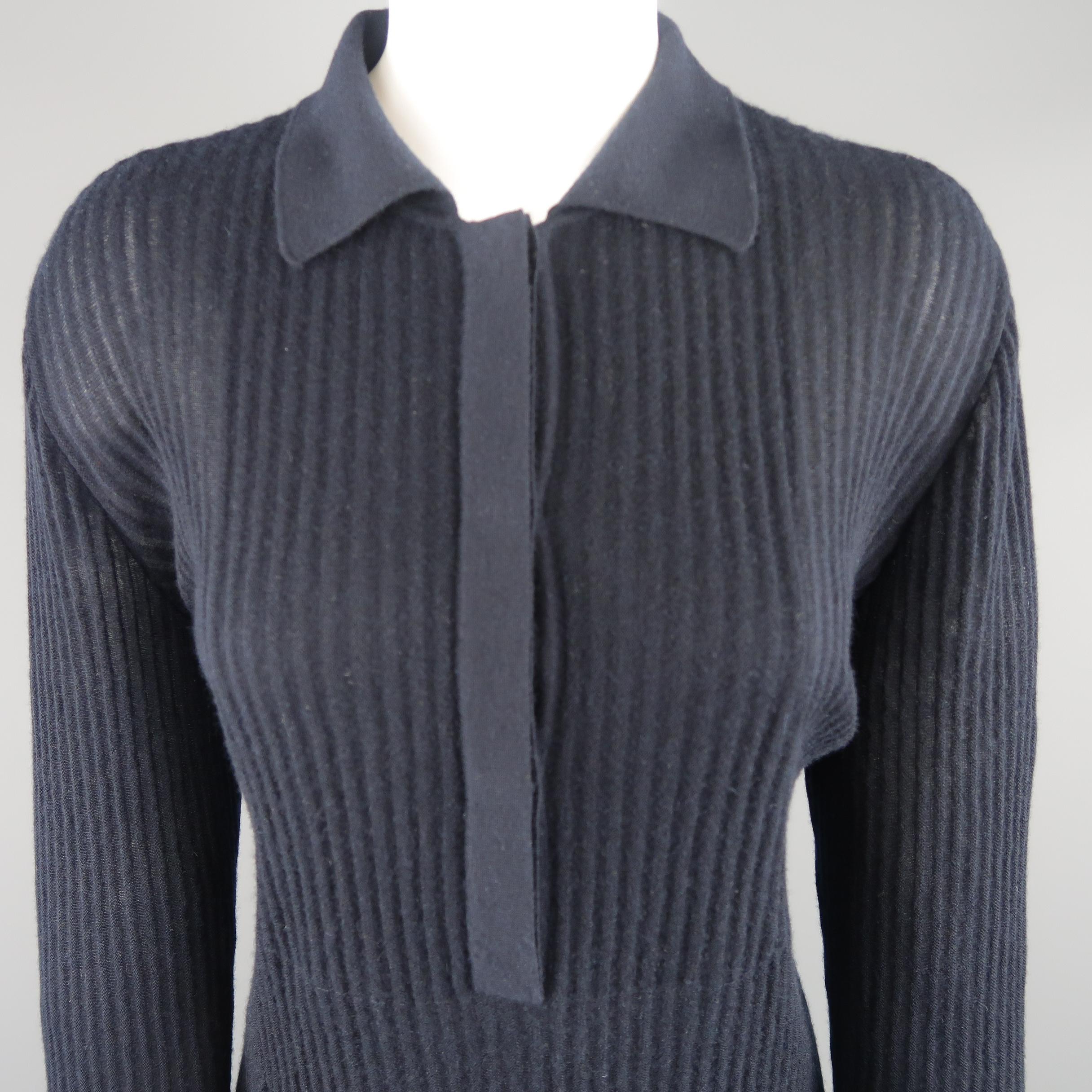 GIORGIO ARMANI pullover comes in sheer ribbed cashmere knit with a half button collared front. Made in Italy.
 
Excellent Pre-Owned Condition.
Marked: IT 46
 
Measurements:
 
Shoulder: 16 in.
Bust: 40 in.
Sleeve: 24 in.
Length: 26 in.