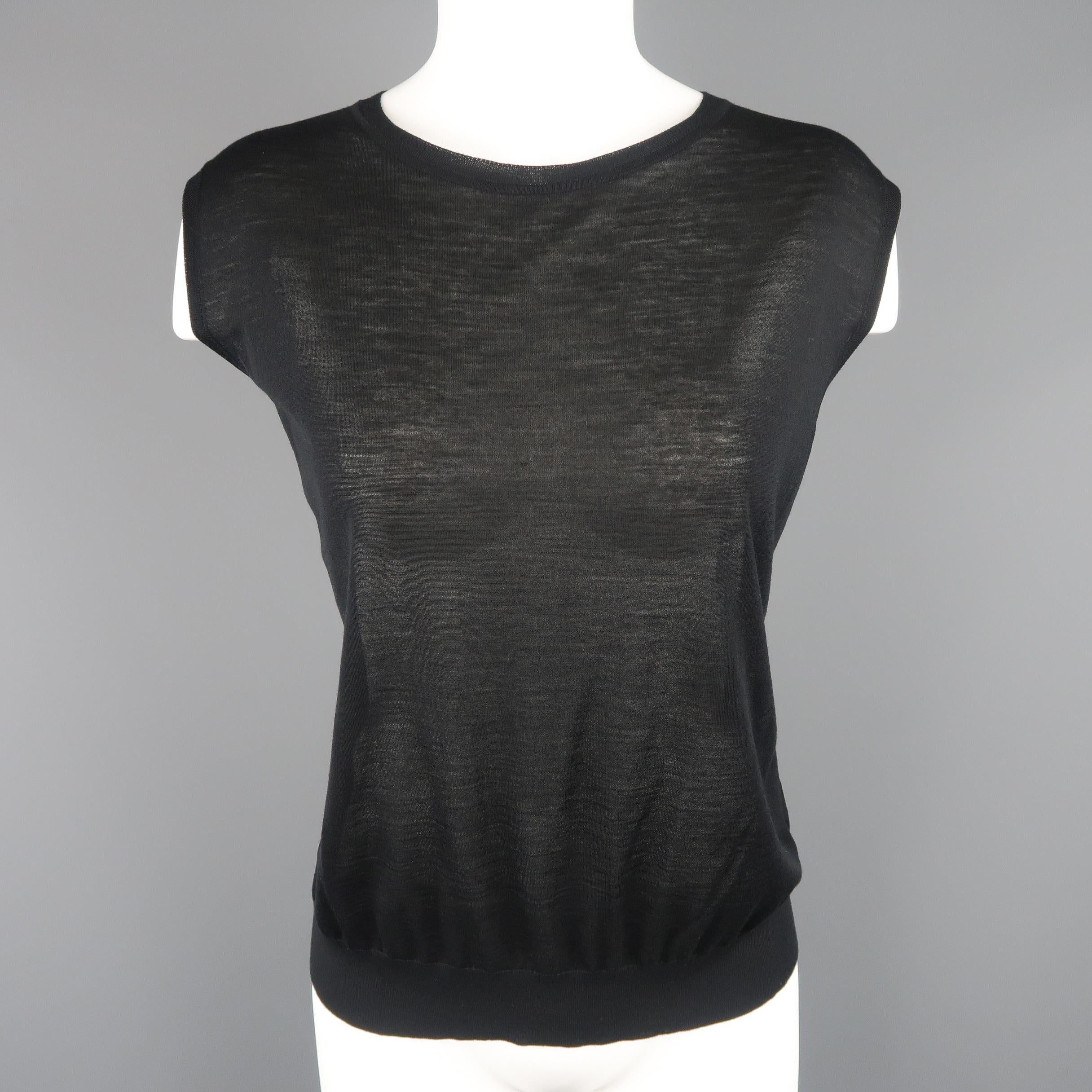 GIORGIO ARMANI sweater set comes in light weight, ultra sheer virgin wool knit and includes a sleeveless pullover and v neck sweater. Made in Italy.
 
Excellent Pre-Owned Condition.
Marked: IT 40
 
Measurements:
 
Top:
Shoulder:17 in.
Bust: 44