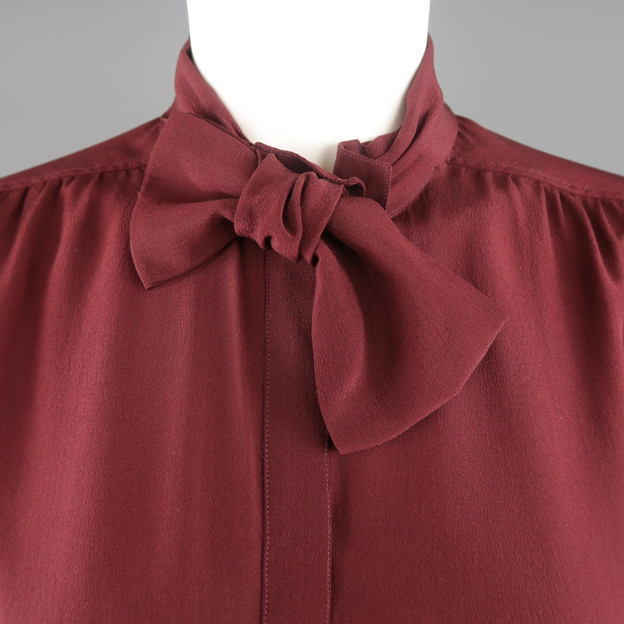 BURBERRY PRORSUM blouse comes in burgundy red silk crepe with a hidden placket front and bow collar. Stain on back. As-is. Made in Italy.
 
Fair Pre-Owned Condition.
Marked: IT 42
 
Measurements:
 
Shoulder: 15 in.
Bust: 42 in.
Sleeve: 25