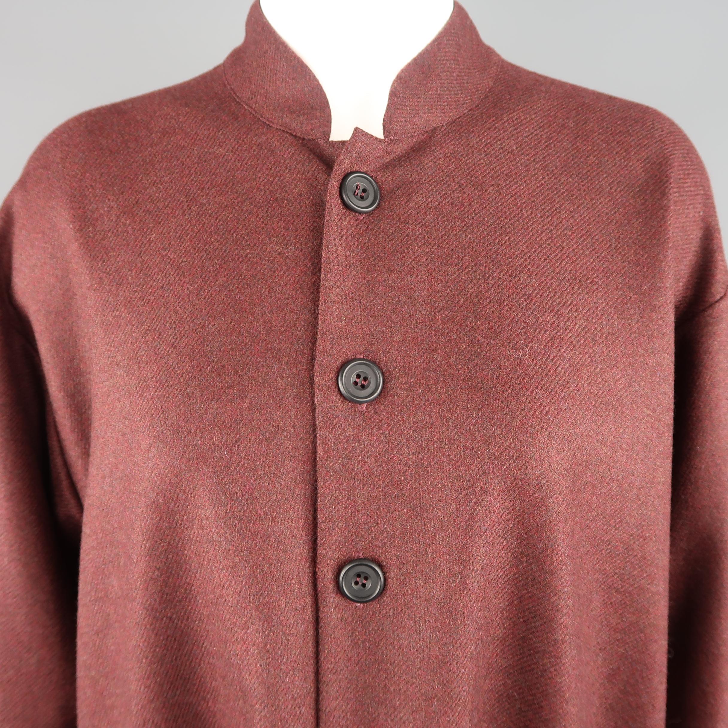 ESKANDAR coat comes in heathered burgundy wool cashmere twill textured felt with a stand up collar, button up front, oversized silhouette, and patch pockets.
 
Excellent Pre-Owned Condition.
Marked: 0
 
Measurements:
 
Shoulder: 21 in.
Bust: 46