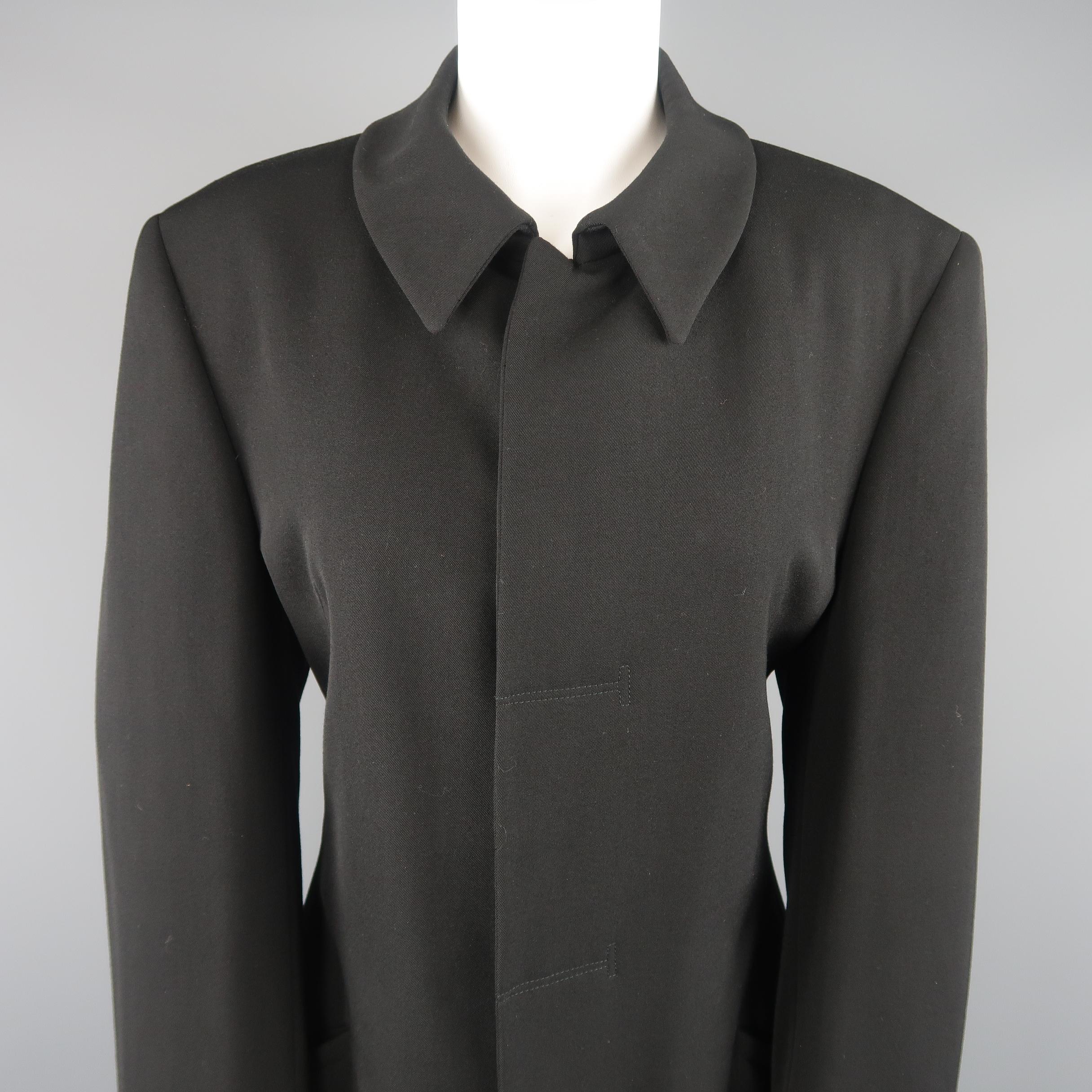 GIORGIO ARMANI car coat comes in black wool twill with a pointed collar, slanted pockets, and hidden placket snap closures. Made in Italy.
 
Good Pre-Owned Condition.
Marked: IT 48
 
Measurements:
 
Shoulder: 18 in.
Bust: 42 in.
Waist: 27