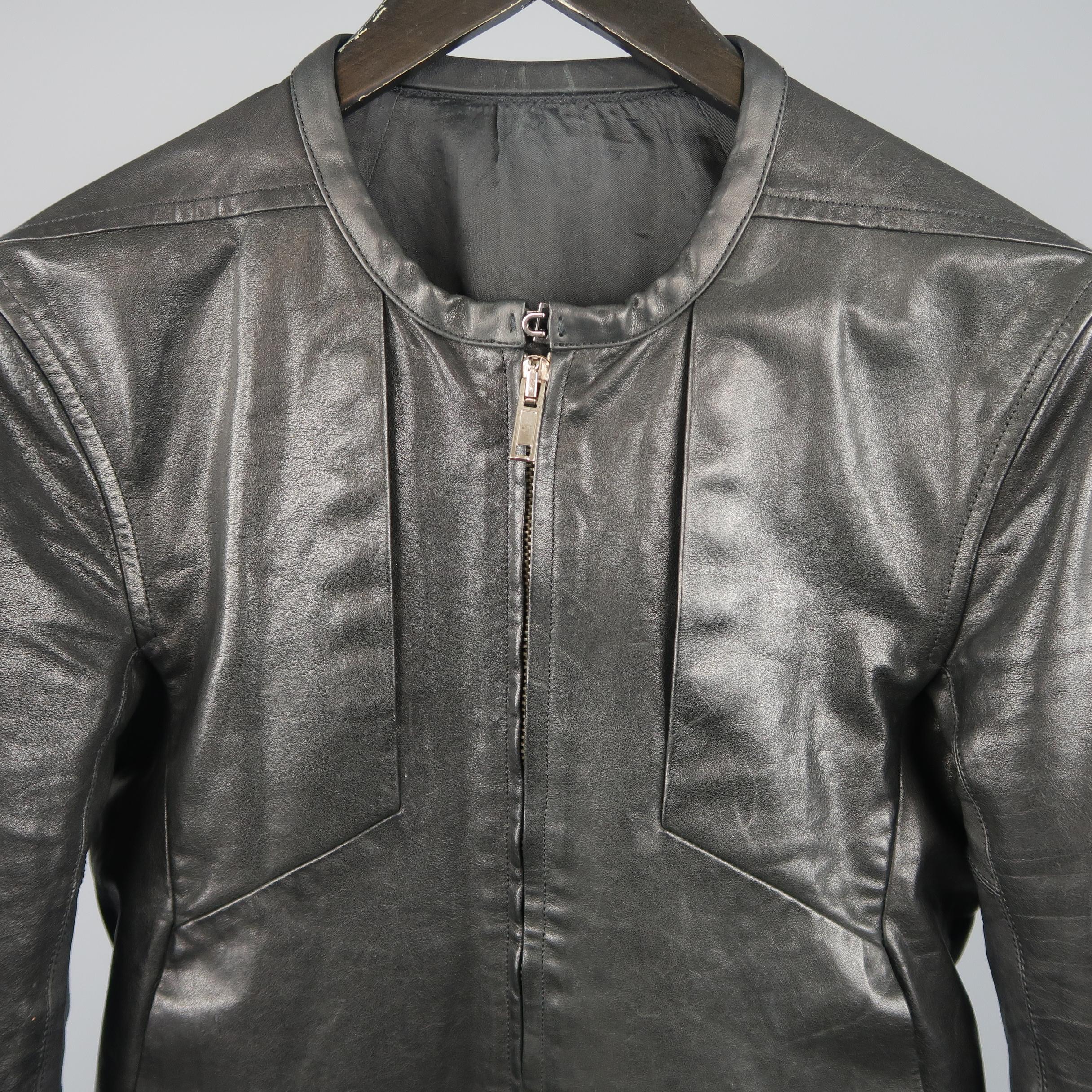 RICK OWENS biker jacket comes in black leather with a round collarless hook eye neckline, zip front, four slit pockets, and button cuffs. Wear consistent with age/use. Made in Italy.
 
Good Pre-Owned Condition.
Marked: US 36
 
Measurements:
