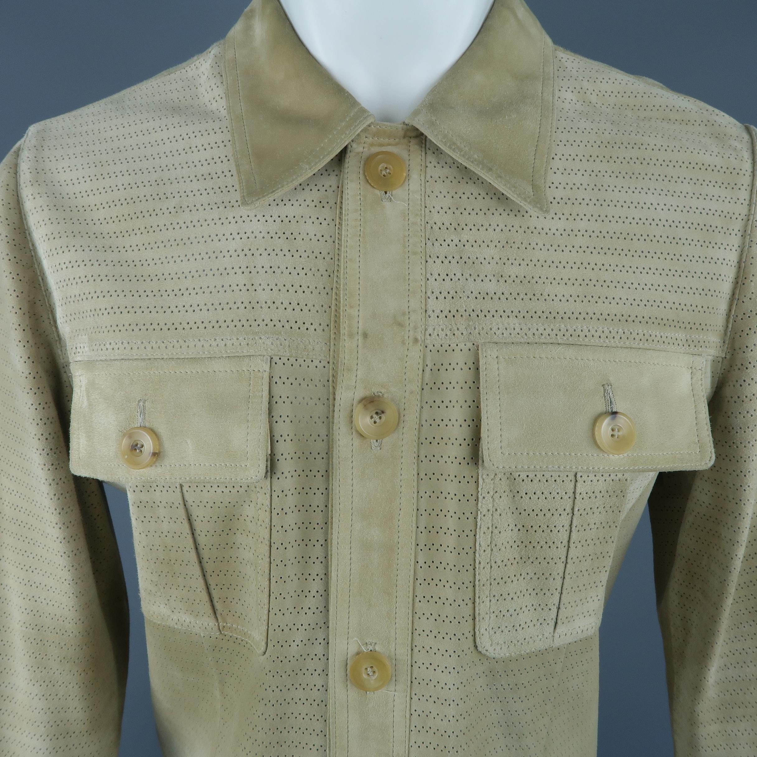Archive GUCCI by TOM FORD jacket comes in perforated beige suede with a pointed collar, button up front, and four patch flap safari jacket pockets. Wear and discolorations throughout. As-is. Made in Italy.
 
Fair Pre-Owned Condition.
Marked: IT 48
