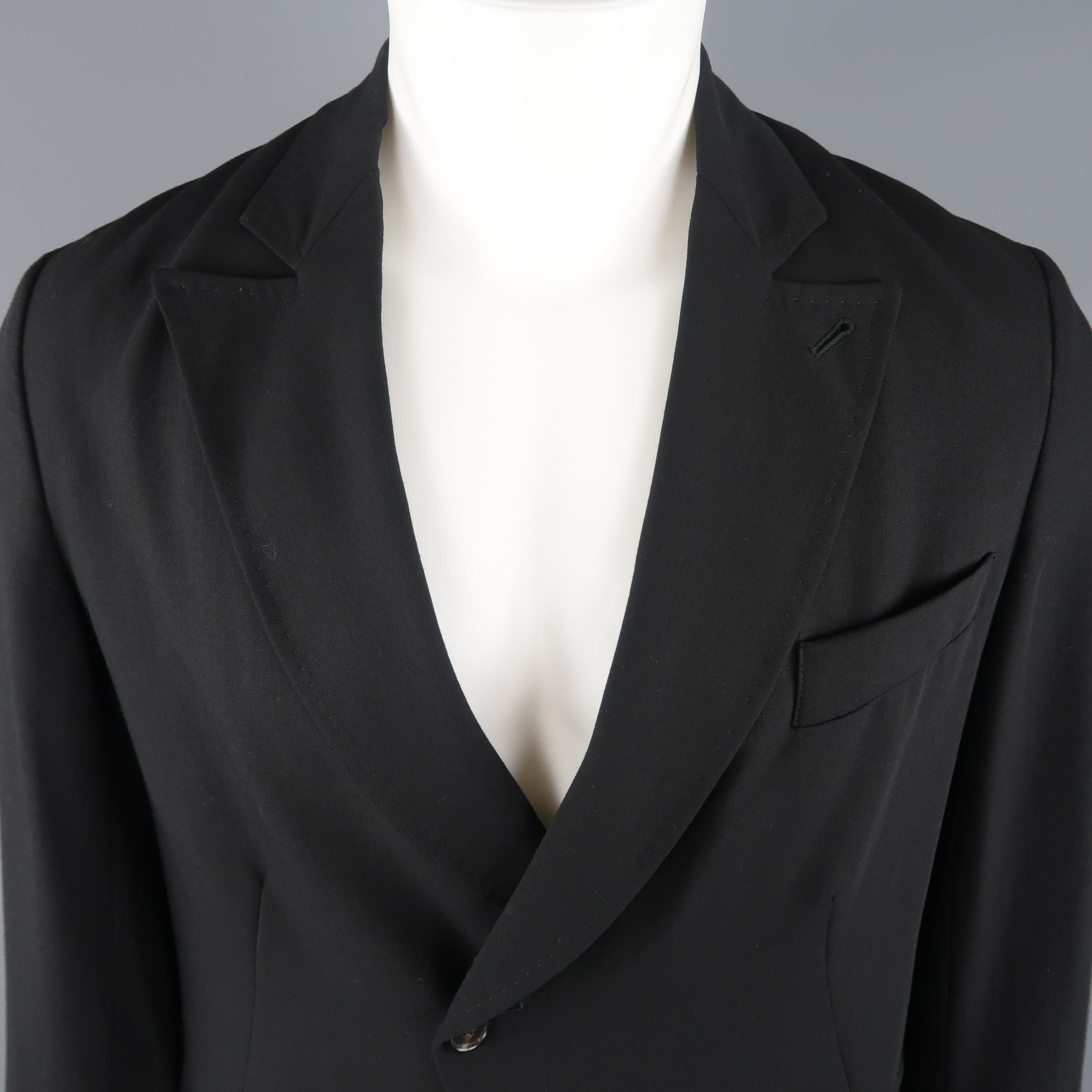ANN DEMEULEMEESTER jacket comes in an ultra light weight sheer wool twill with a peak lapel, boxy silhouette, cropped hem, and two button front.  Made in Italy.
 
Excellent Pre-Owned Condition.
Marked: XXS
 
Measurements:
 
Shoulder: 18 in.
Chest: