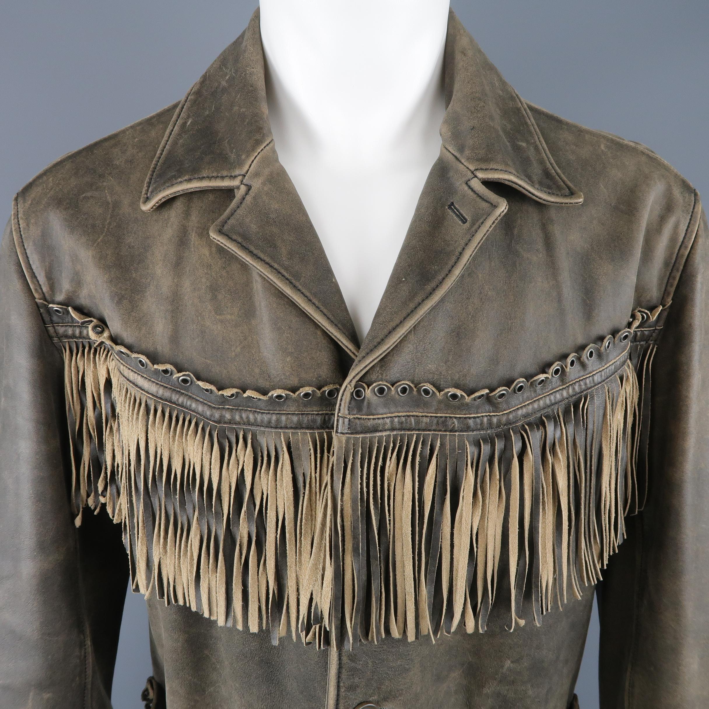 NICOLE FARHI jacket comes in distressed leather with a pointed collar, patch pockets, and fringe trim with scalloped, grommet embellished piping. Made in Italy.
 
Good Pre-Owned Condition.
Marked: 40
 
Measurements:
 
Shoulder: 19 in.
Chest: 46