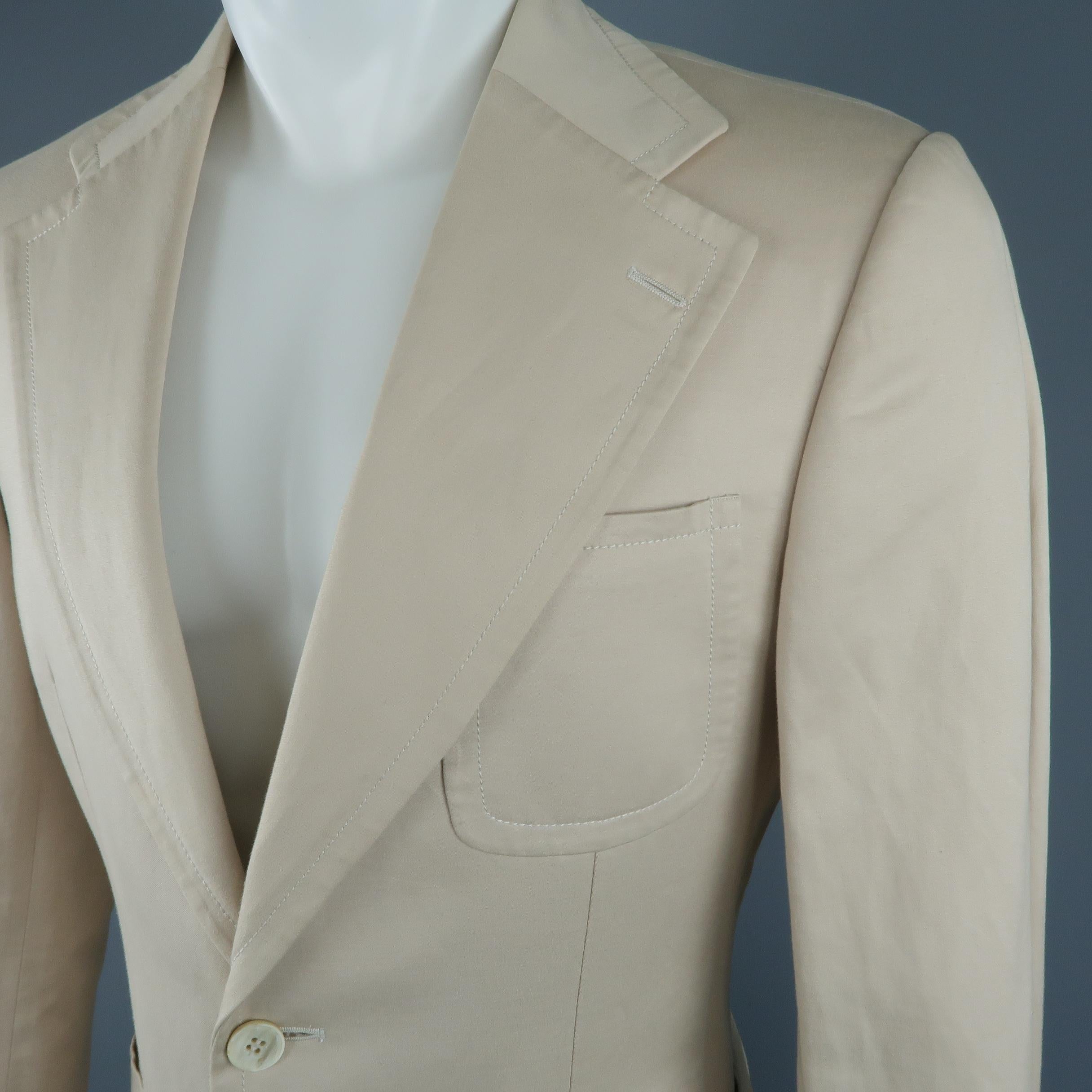 Archive GUCCI by TOM FORD sing breasted sport coat comes in a khaki beige linen cotton blend fabric with a wide notch lapel, two button front, and triple patch pockets. Wear and stains throughout. As-is.
 
Fair Pre-Owned Condition.
Marked: IT 48
