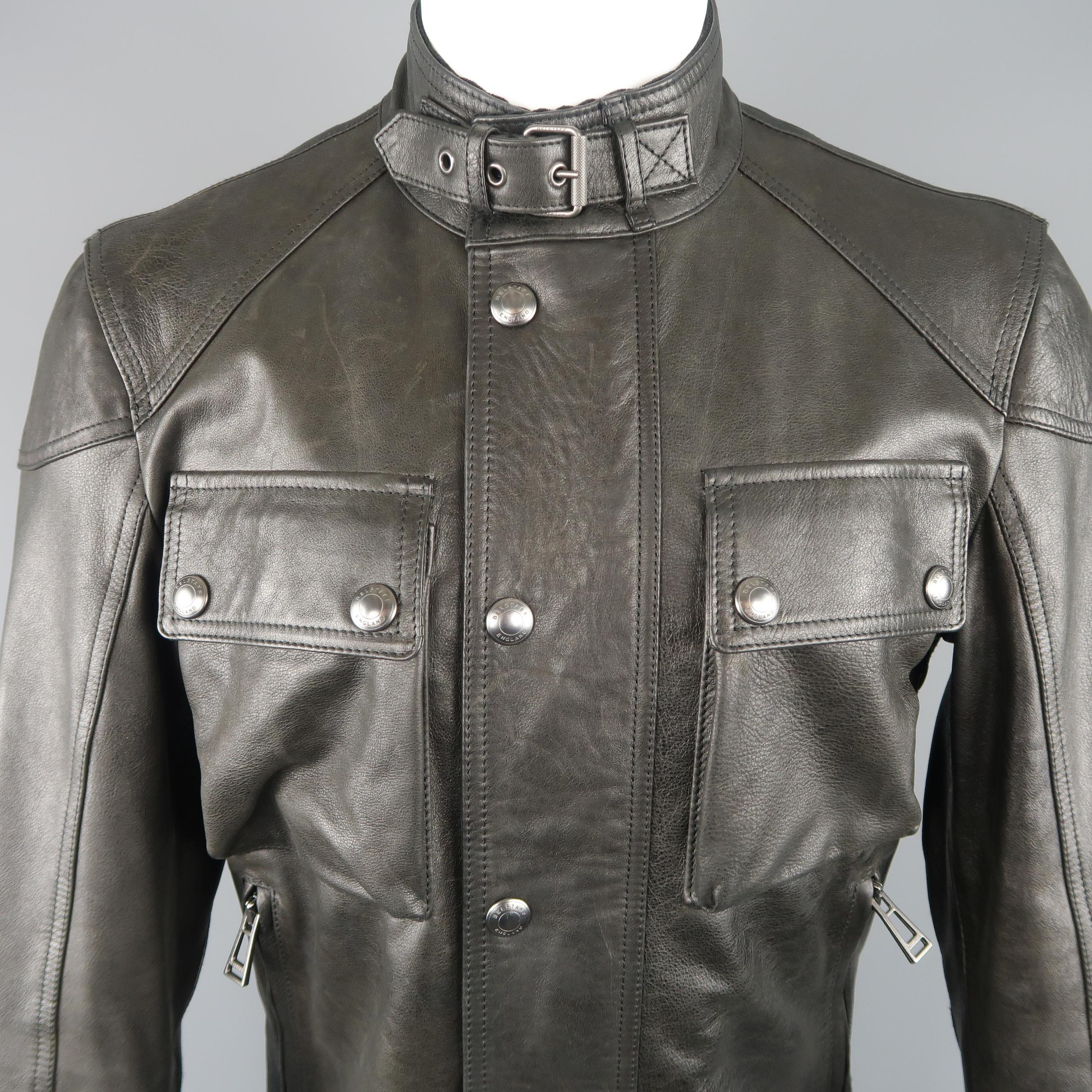 BELSTAFF Racemaster 'Gangster 2.0' biker jacket comes in black leather with a hgh buckled collar, zip closure with snap placket, zip pockets, patch flap chest pockets, and side tabs. Made in Italy.
 
Excellent Pre-Owned Condition.
Marked: IT 48
