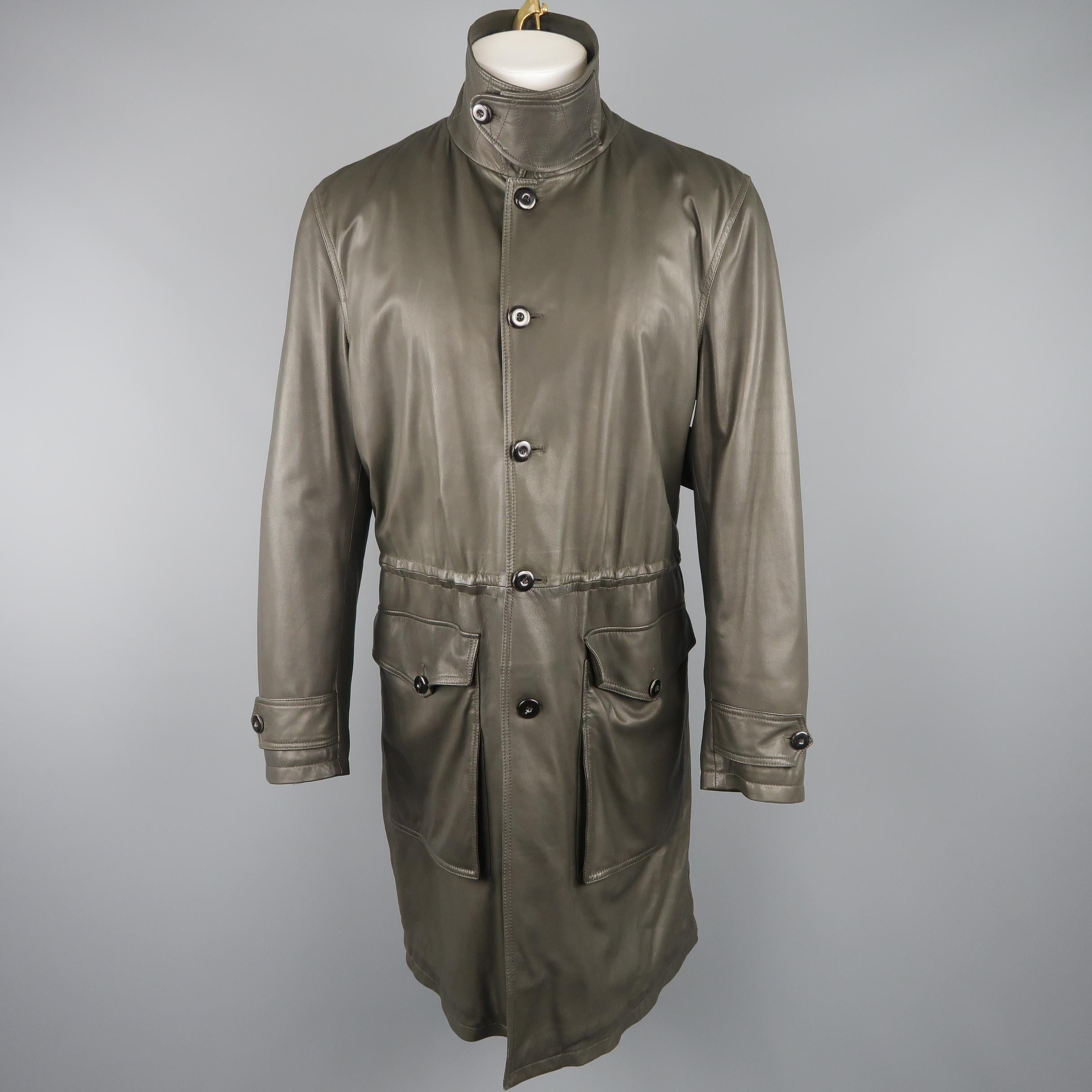 GIORGIO ARMANI coat comes in olive green smooth lambskin leather with a pointed collar, button up front, patch flap pockets, tab cuffs, and elastic drawstring waist. Made in Italy.
 
Good Pre-Owned Condition.
Marked: IT 50
 
Measurements:
