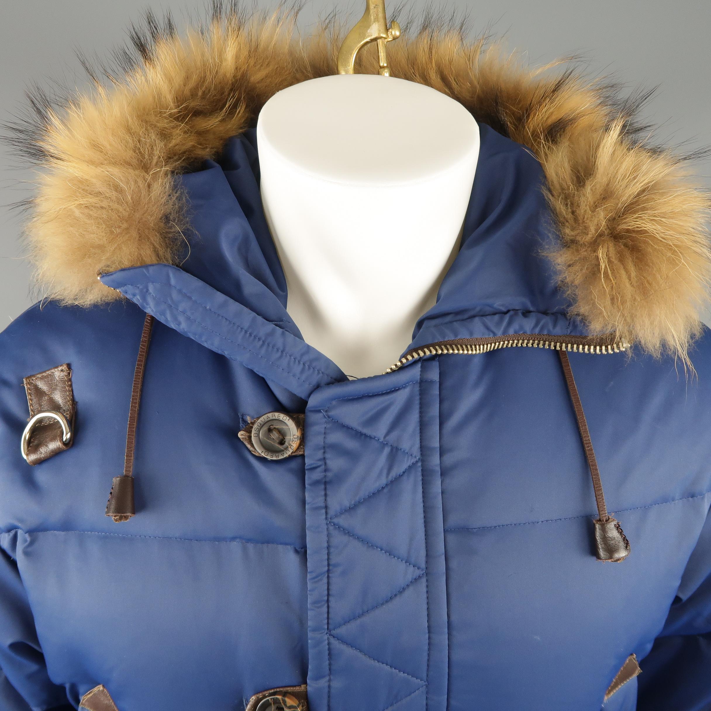 DSQUARED2 parka come sin down filled dark blue nylon with leather accents, zip front with placket, snap pockets, arm parch, and fur trimmed hood. Wear throughout.
 
Good Pre-Owned Condition.
Marked: IT 48
 
Measurements:
 
Shoulder: 21 in.
Chest: 46