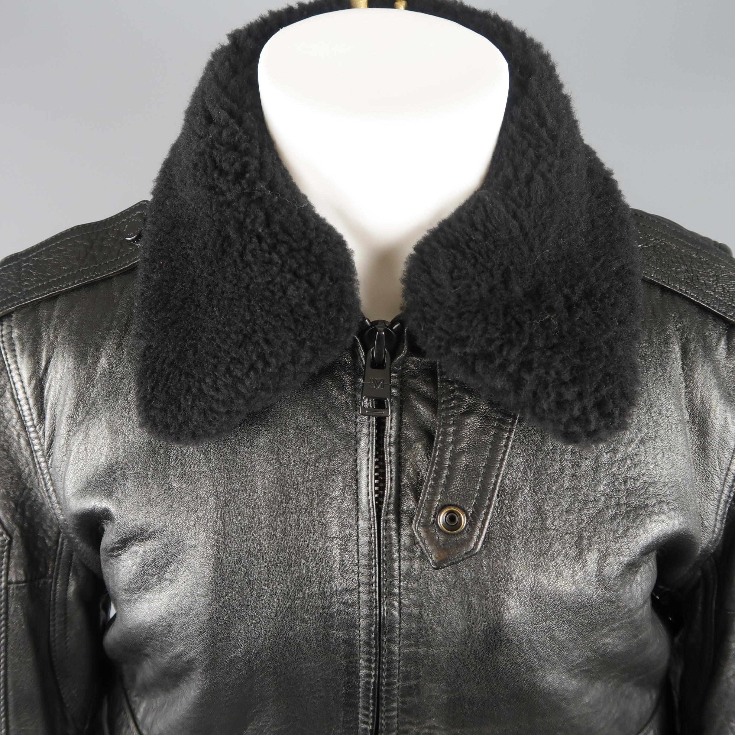 ANDREW MARC bomber jacket comes in textured black leather with a zip front, flap patch pockets, epaulets, and detachable shearling layer collar.
 
Excellent Pre-Owned Condition.
Marked: S
 
Measurements:
 
Shoulder: 17 in.
Chest: 44 in.
Sleeve: 25