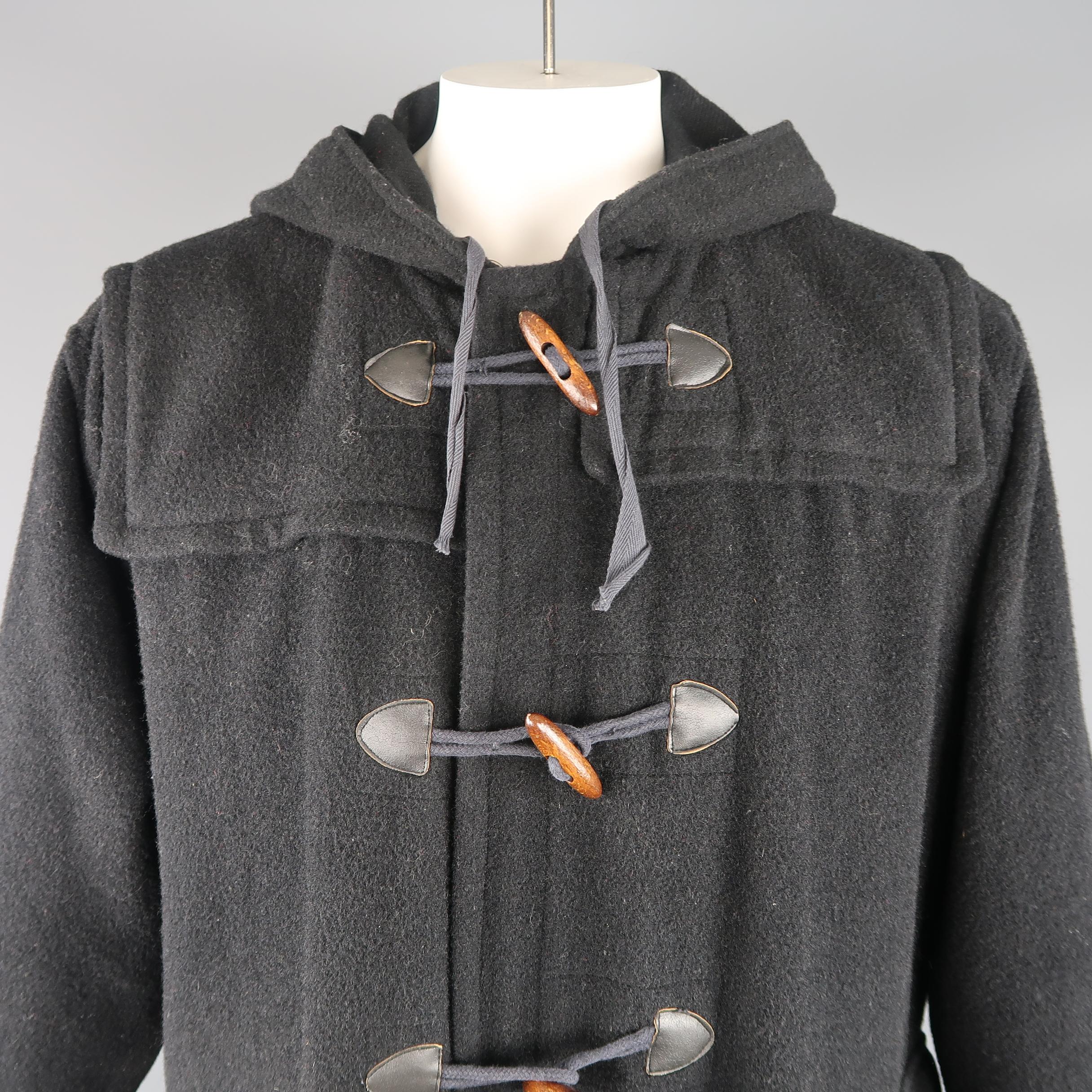 Vintage Junior Gaultier By Jean Paul Gaultier coat comes in a wool blend felt with an oversized silhouette, toggle closures, patch flap pockets, and drawstring hood. Minor wear throughout. Made in Italy.
 
Good Pre-Owned Condition.
Marked: L
