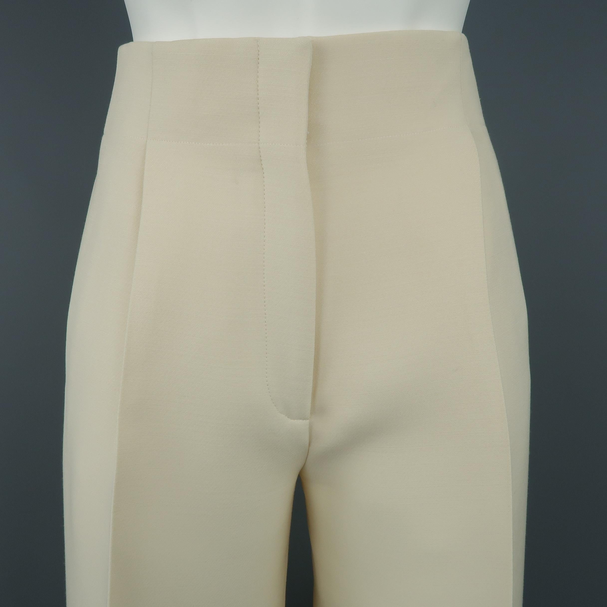 CELINE Resort 2015 culotte dress pants come in cream wool silk blend material with a high rise, single pleat front, and cropped wide leg. Made in Italy.
 
Excellent Pre-Owned Condition.
Marked: FR 34
 
Measurements:
 
Waist: 26 in.
Rise: 12