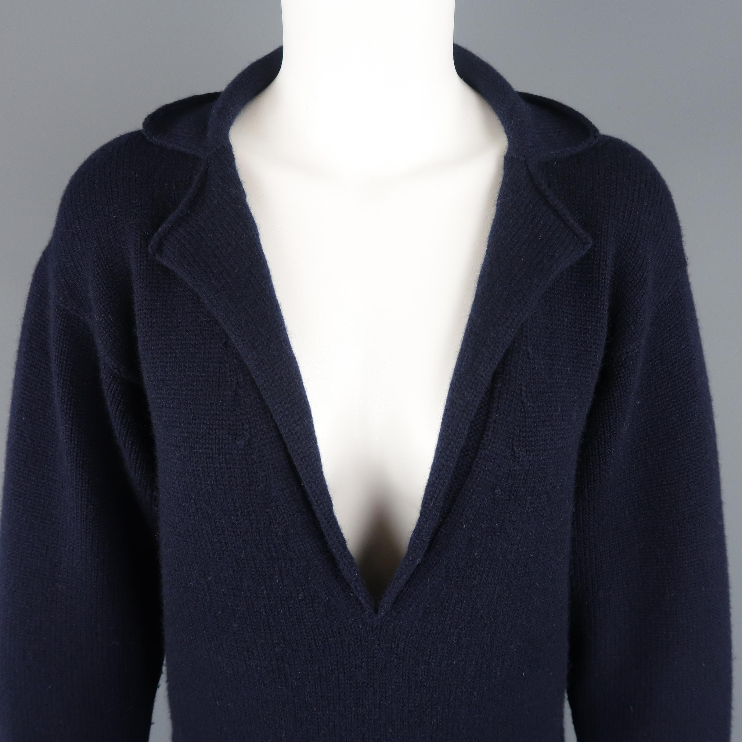 CHANEL mini sweater dress comes in navy blue cashmere knit with a deep V neck, notch lapel, and patch pockets. Minor wear throughout. As-is. Made in Italy.
 
Good Pre-Owned Condition.
Marked: FR 36
 
Measurements:
 
Shoulder: 20 in.
Bust: 38