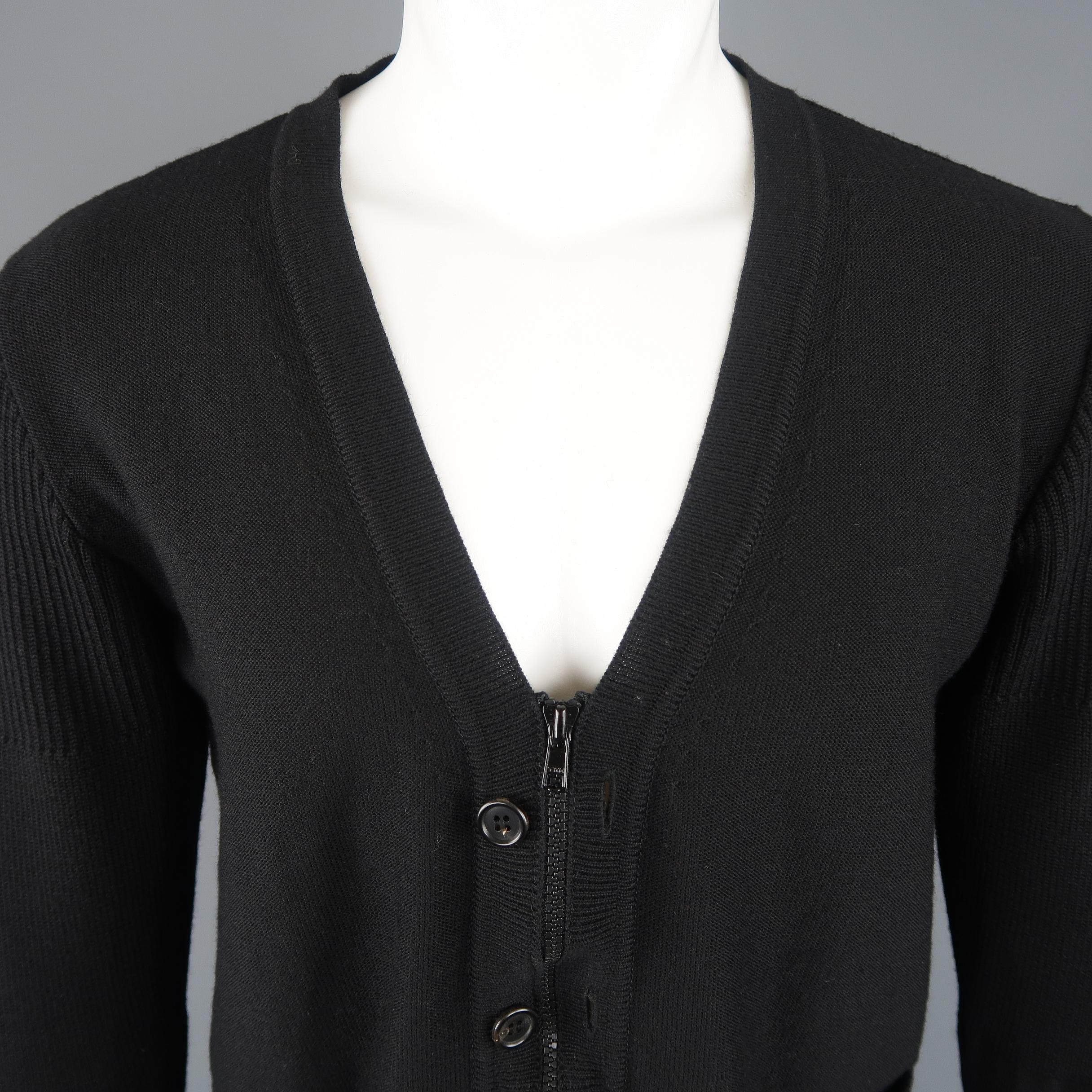 UNDERCOVER cardigan comes in light weight black wool knit with a V neck, pockets, and optional zip or button closure. Made in Japan.
 
Excellent Pre-Owned Condition.
Marked: JP 3
 
Measurements:
 
Shoulder: 16 in.
Chest: 44 in.
Sleeve: 25