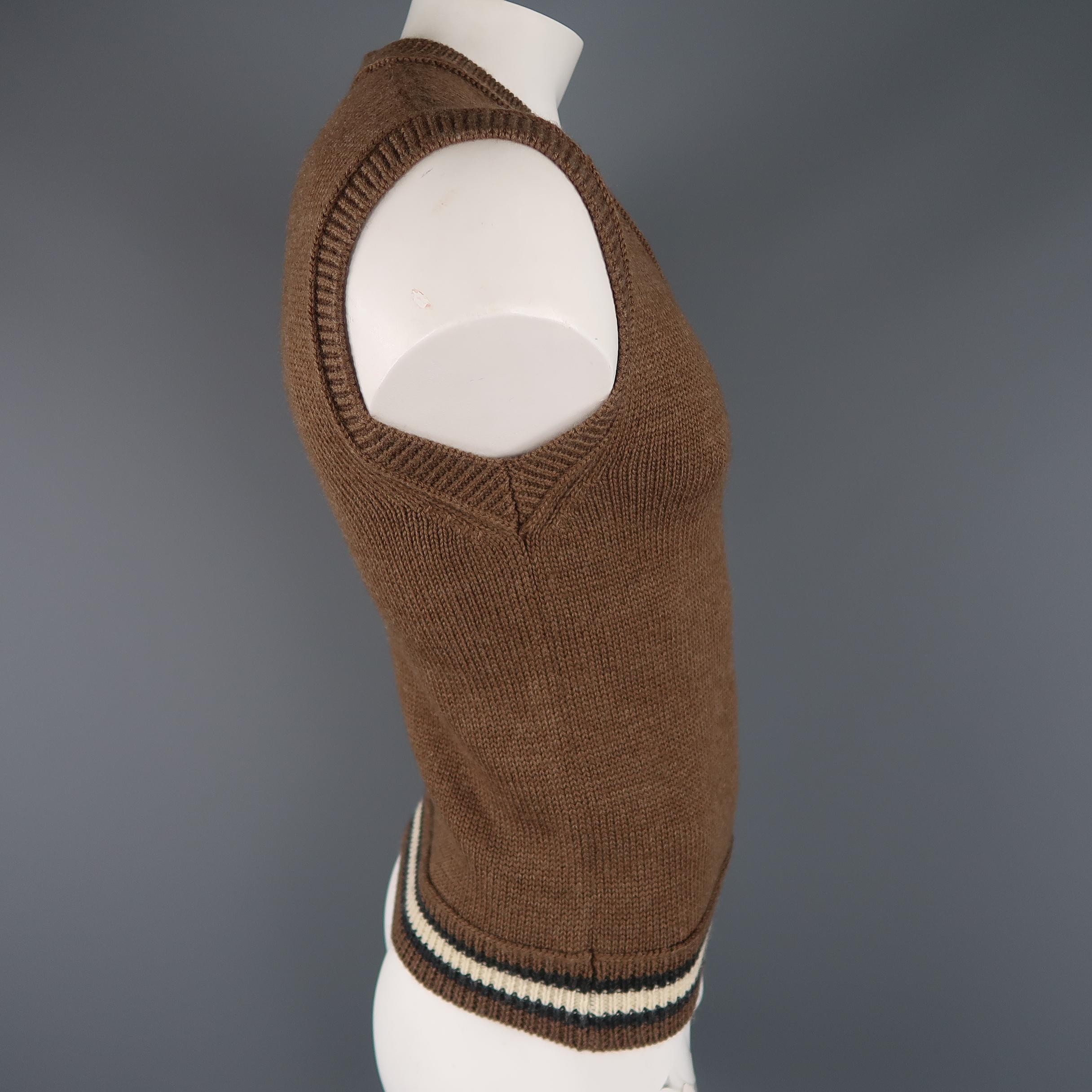 Vintage JEAN PAUL GAULTIER sweater vest comes in a taupe brown wool knit with a V neck, striped waistband, and signature back tab. Made in Italy.
 
Excellent Pre-Owned Condition.
Marked: L
 
Measurements:
 
Shoulder: 20 in.
Chest: 38 in.
Length: 25