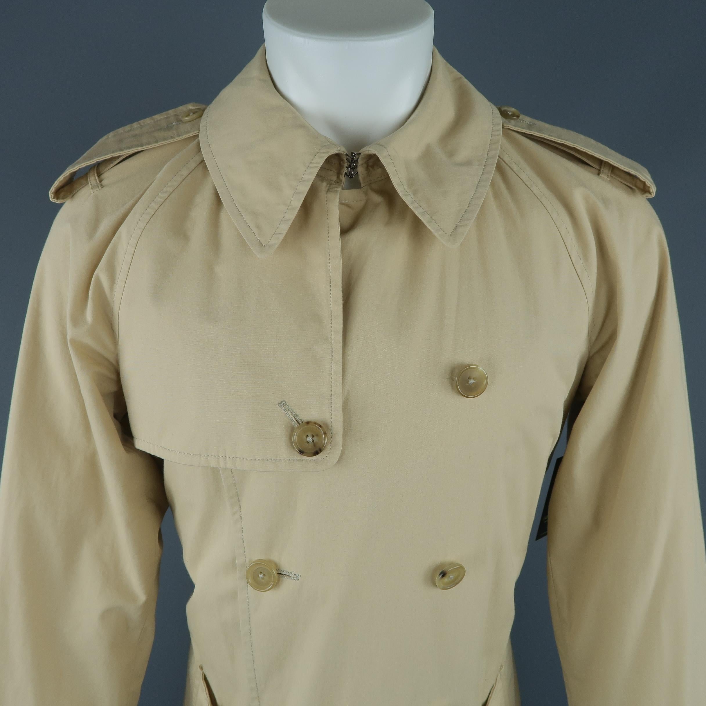 Ralph Lauren Purple Label trench coat comes in classic khaki cotton with a hook eye collar, storm flap, epaulets, double breasted closure, flap pockets, belted waist, and belted cuffs. Mark on epaulet. As-is Made in Italy.
 
Fair Pre-Owned