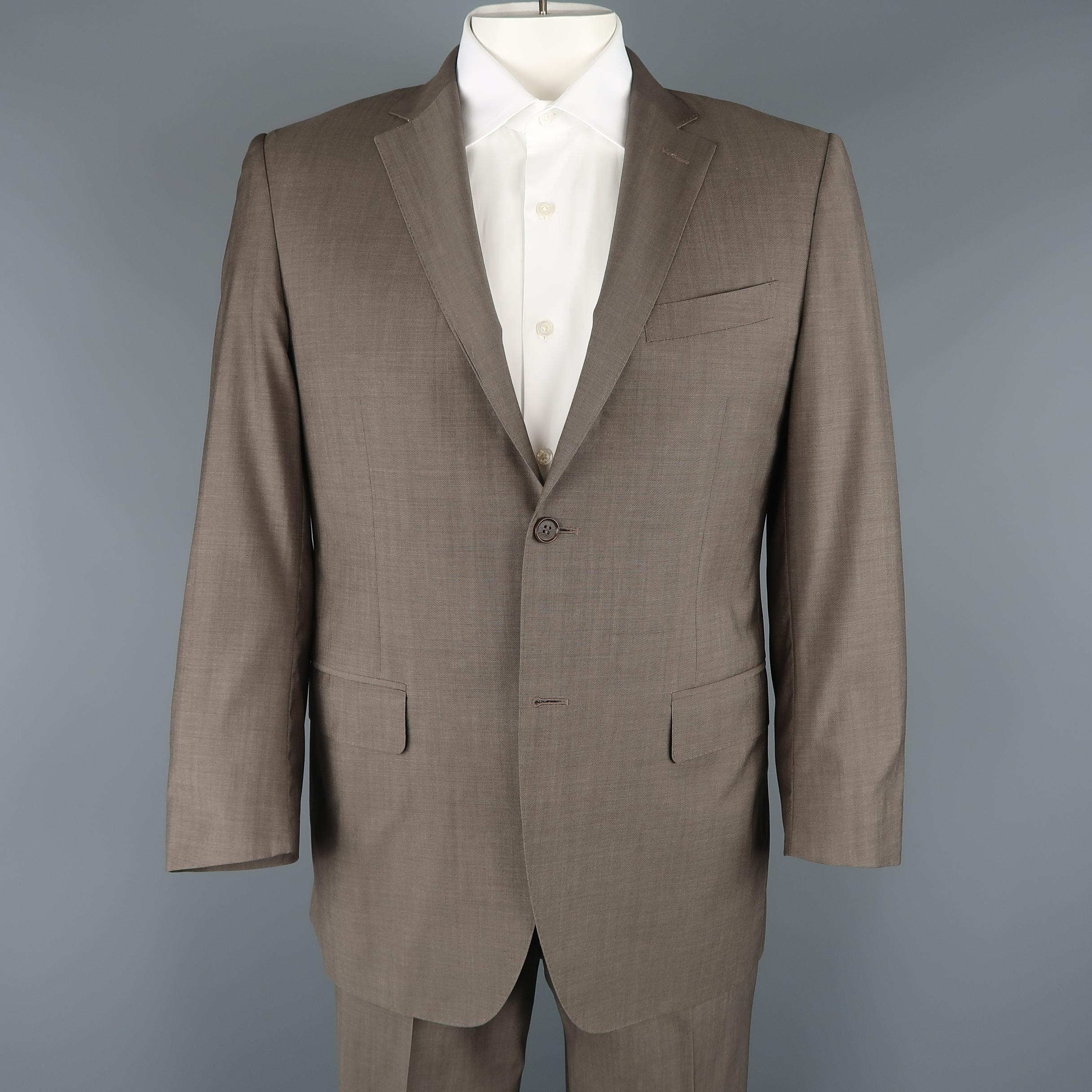 Two piece CANALI suit comes in taupe wool and includes a single breasted, two button sport coat with a notch lapel and top stitching with matching flat front trousers. Made in Italy.
 
Excellent Pre-Owned Condition.
Marked: IT 52 R
 
Measurements:
