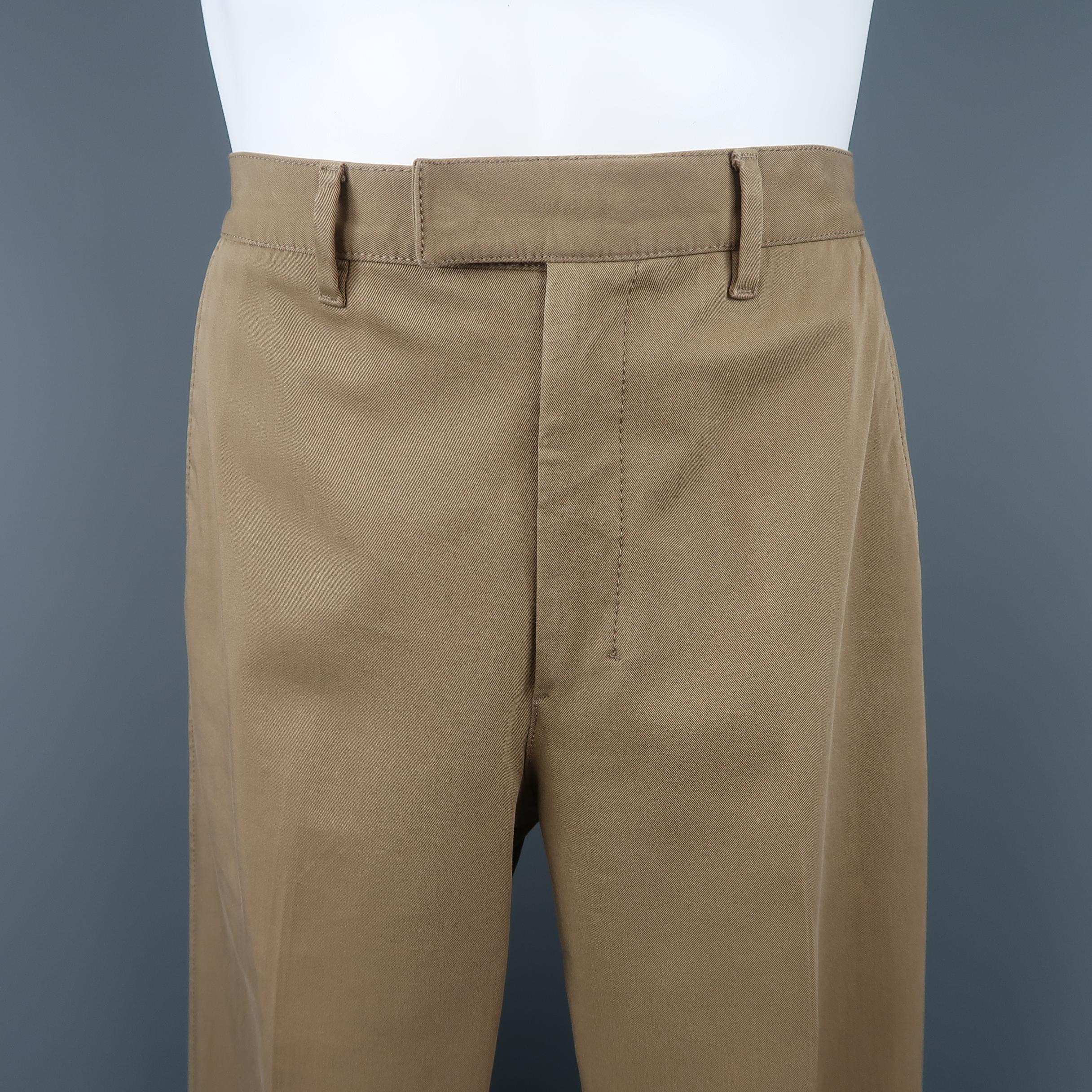 PRADA pants come in a tan beige cotton blend twill with a straight leg and covered fly closure. Made in Italy.
 
Good Pre-Owned Condition.
Marked: IT 50
 
Measurements:
 
Waist: 32 in.
Rise: 11.5 in.
Inseam:  30 in.