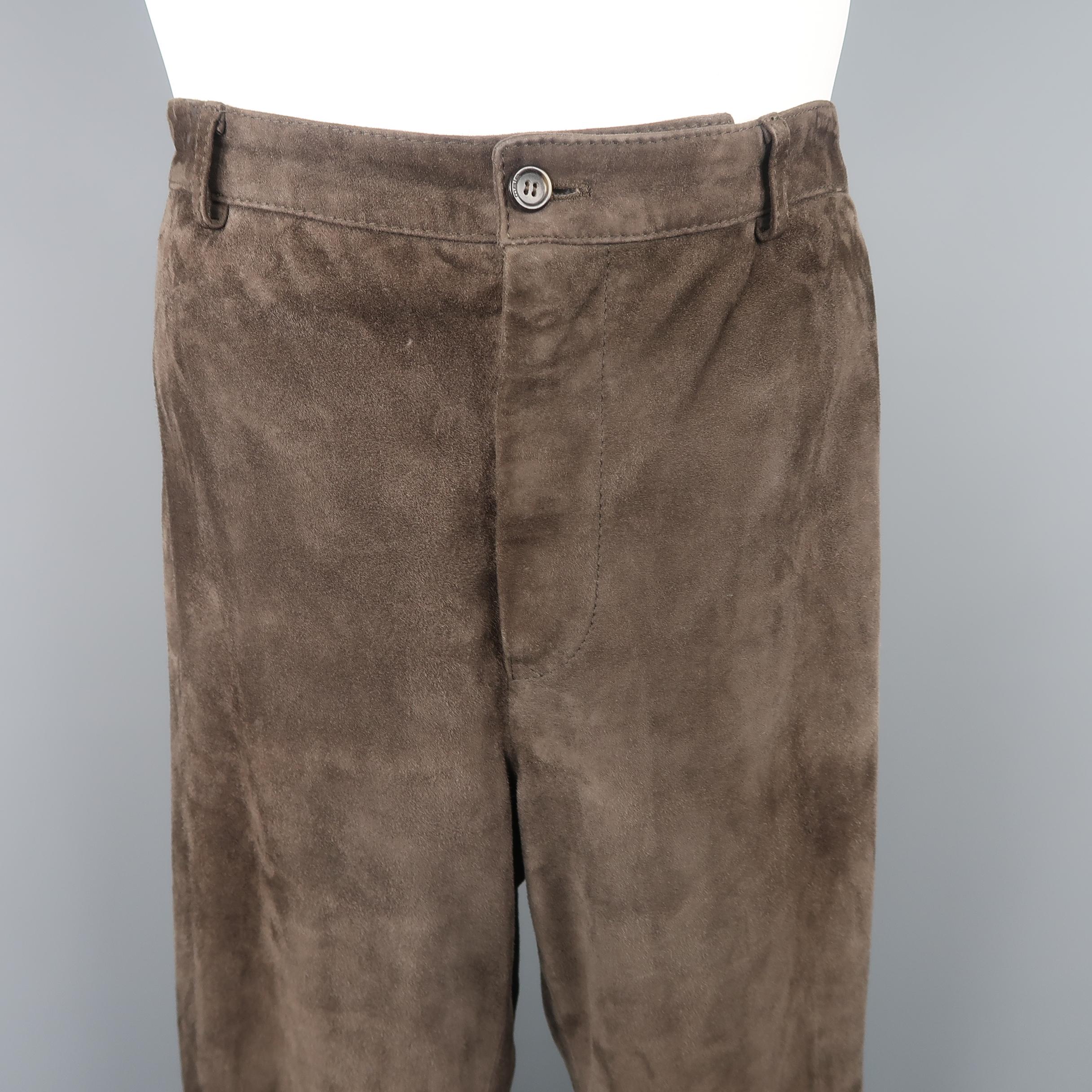 MALO casual pants come in neutral brown suede with a zip fly, straight leg, and button pockets. Made in Italy.
 
Good Pre-Owned Condition.
Marked: IT 5
 
Measurements:
 
Waist: 32 in.
Rise: 11 in.
Inseam: 32 in.
