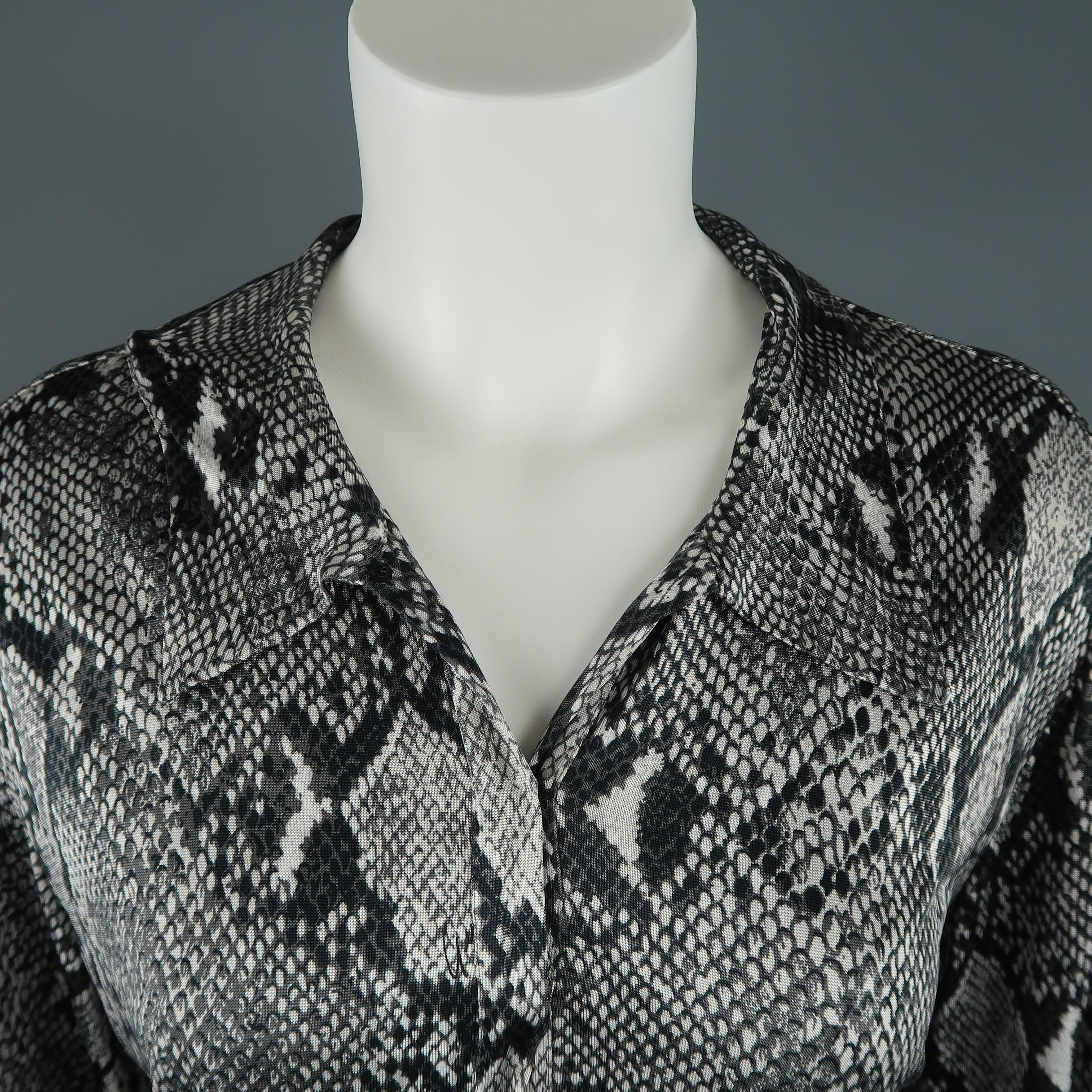 Rare GUCCI Spring 2000 Collection by TOM FORD blouse comes in gray python snake print rayon with an asymmetrical pointed collar, hidden snap half closure, slit cuff sleeves, and elastic waistband. Matching Pants available separately. Made in Italy.
