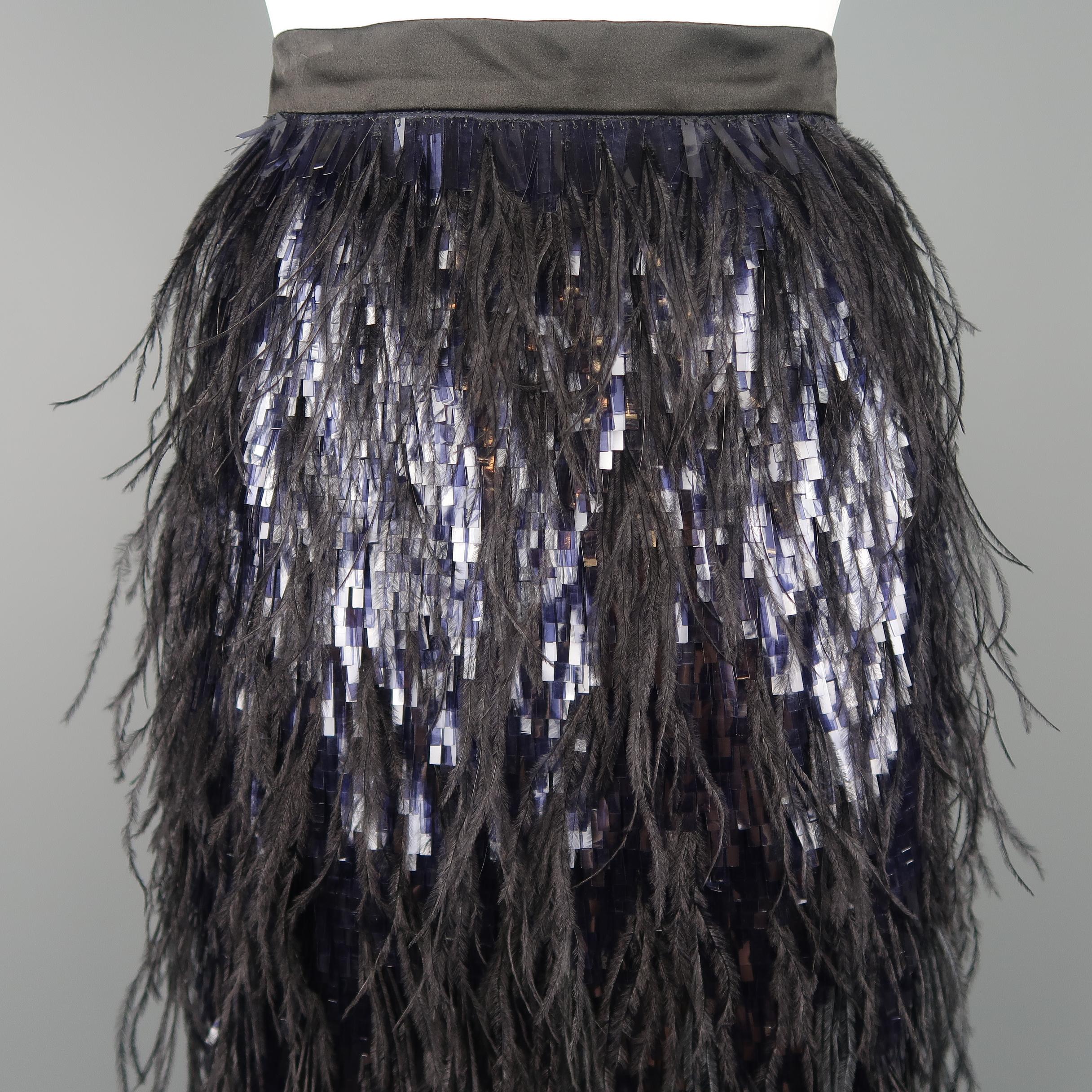 This fabulous Erdem pencil skirt comes in black silk with a long navy sequin embellished frontal panel adorned with black ostrich feathers throughout and a satin waistband and back panel.
 
New with Tags.
Marked: 6
 
Measurements:
 
Waist: 25