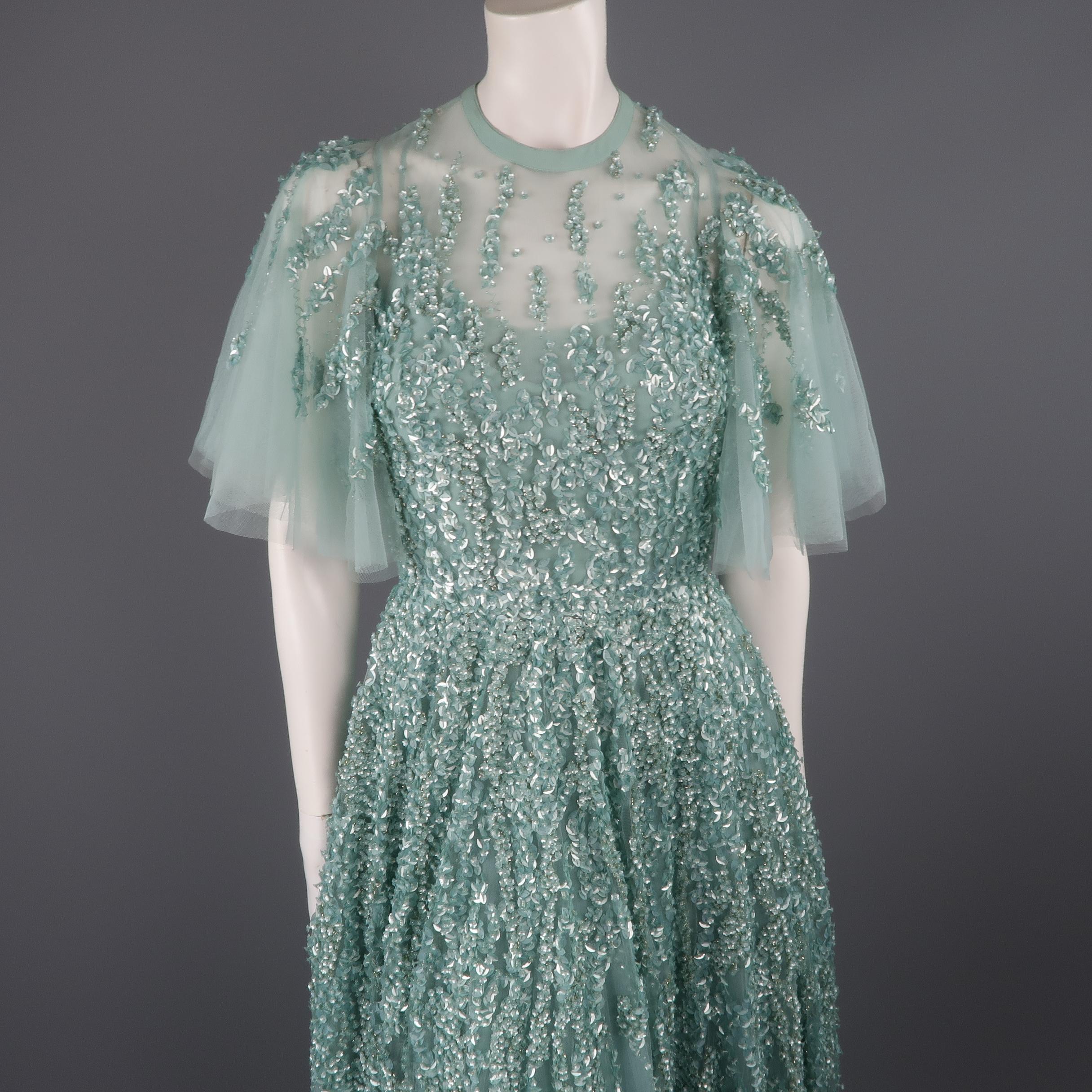 This gorgeous Elie Saab evening gown comes in layered sea foam teal green silk tulle with a round neckline, cropped ruffle sleeves, full layered skirt, and floral sequin beadwork throughout. New with Tags. Marked: FR 36
 
Measurements:
Shoulder: 11