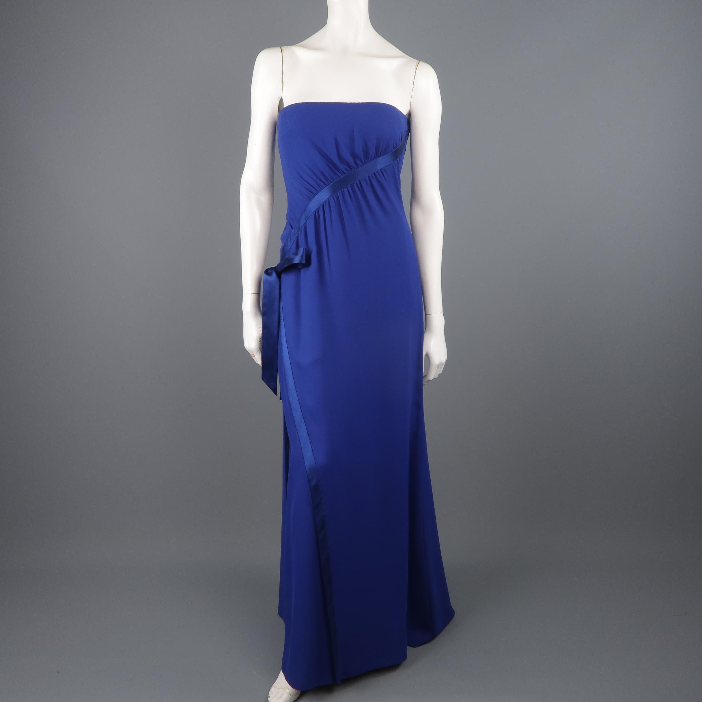 Valentino strapless evening gown comes in royal blue crepe with a built in bustier, slit overlay, and ribbon bow detail with gathering and comes in a draped satin bolero with sequin floral cap sleeves. Wear along neckline from hanger. As is.
 
Fair