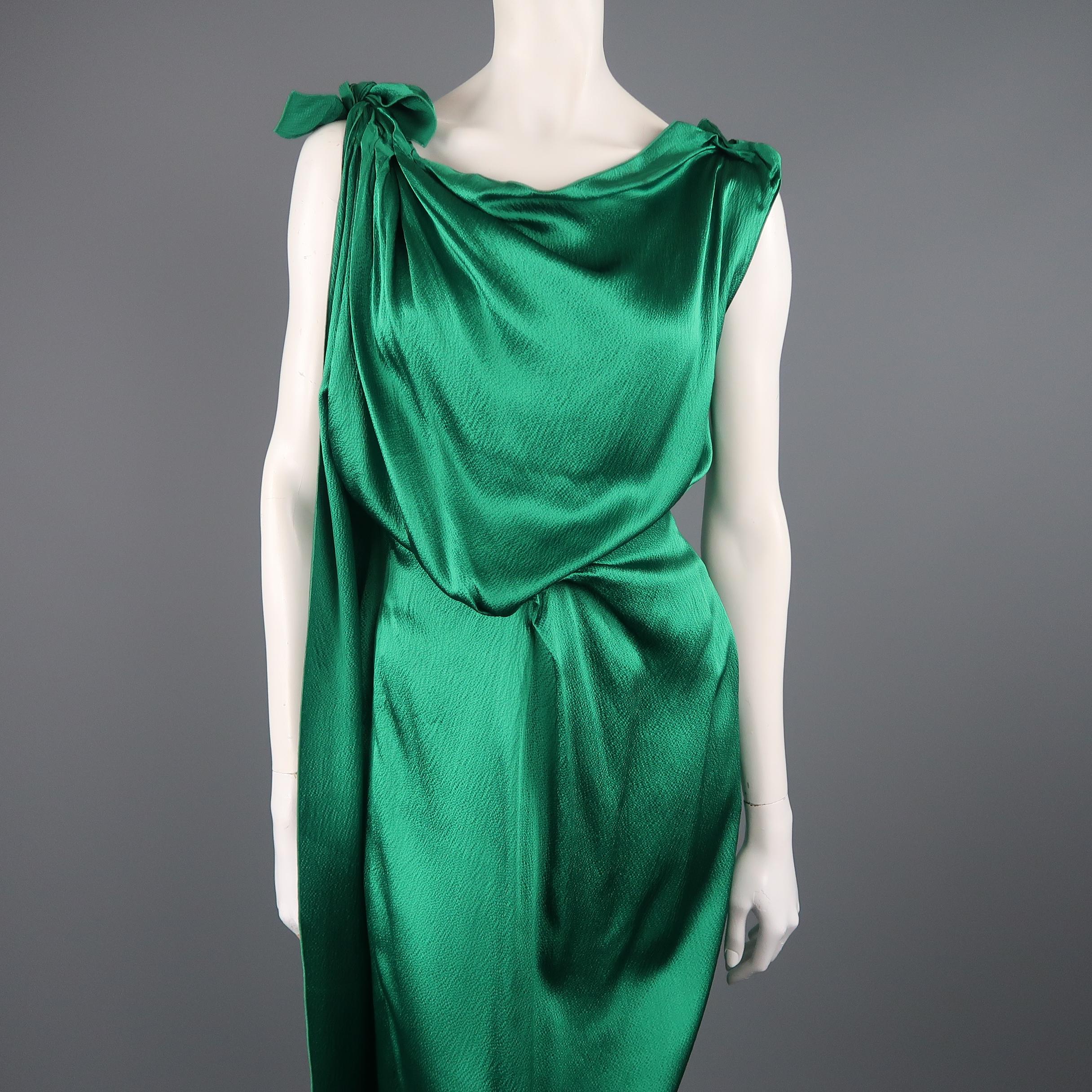 ROLAND MOURET column gown comes in emerald green hammered silk satin with a pleated, tied strap, asymmetrical pleat draped waist, and open side with zip closure.
 
New with Tags.
Marked: 6
 
Measurements:
 
Shoulder: 14 in.
Bust: 40 in.
Waist: 24