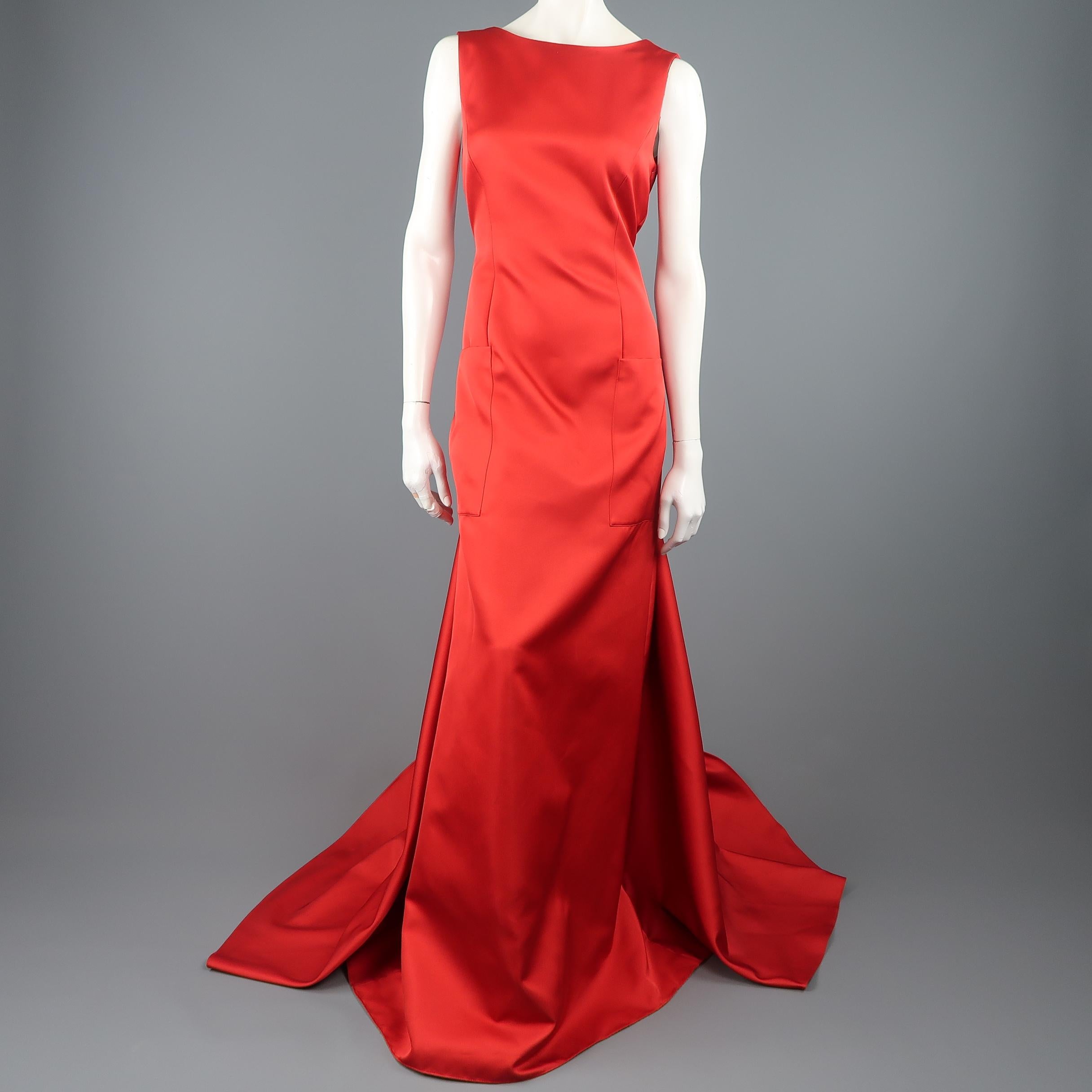 CH Carolina Herrera Spring 2016 Collection evening gown comes in bold red textured satin with a scoop boat neck, oversized patch pockets, open back, and full train. Minor wear throughout. Made in Portugal.
 
Good Pre-Owned Condition.
Marked: 6
