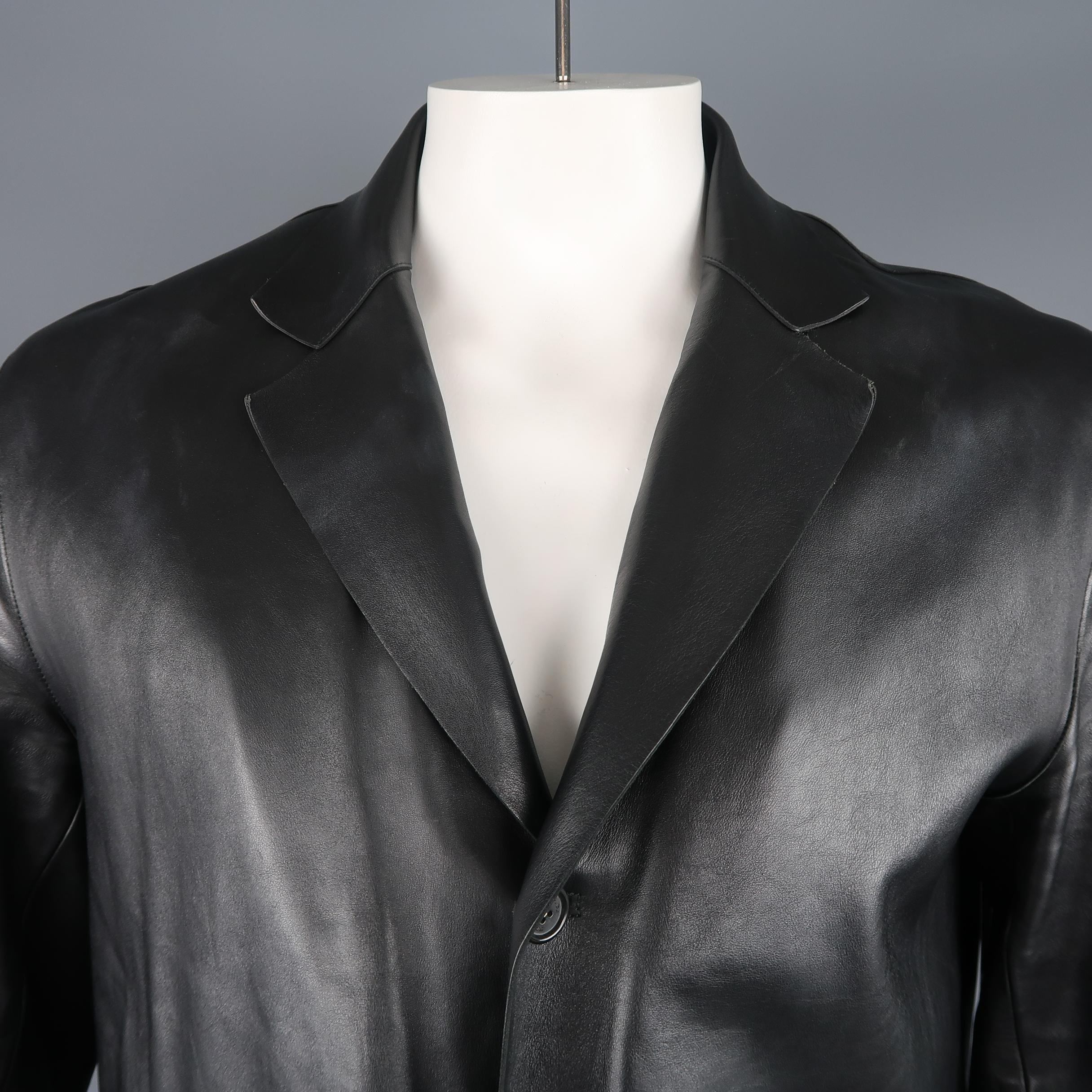 PRADA coat comes in structured black leather with a notch lapel, three button front, slit pockets, and detachable liner. Wear throughout. As-is. Made in Italy.
 
Fair Pre-Owned Condition.
Marked: (no size)
 
Measurements:
 
Shoulder: 19 in.
Chest: