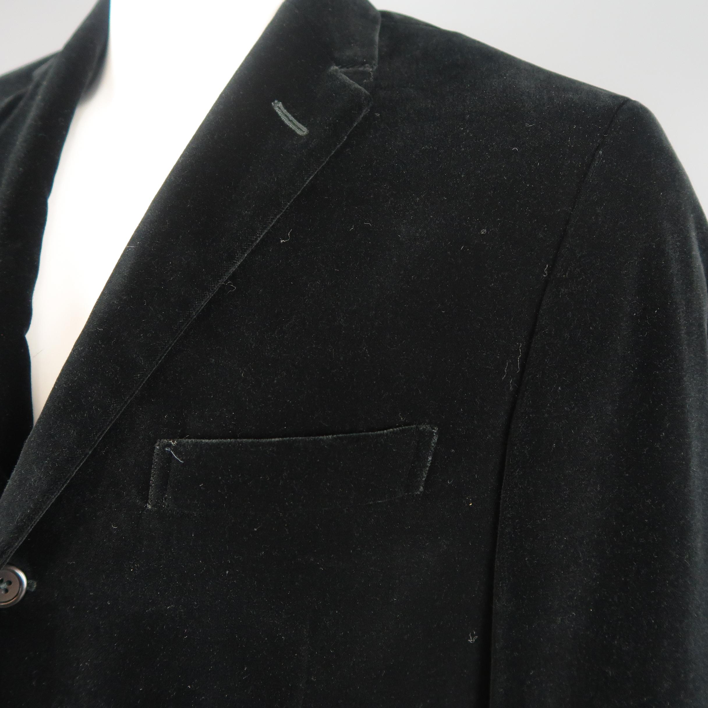 Single breasted POLO RALPH LAUREN sport coat jacket comes in black cotton velvet with a notch lapel, three button front, and flap pockets. Spot by right pocket. Made in Italy.
 
Good Pre-Owned Condition.
Marked: 44 L
 
Measurements:
 
Shoulder: 18