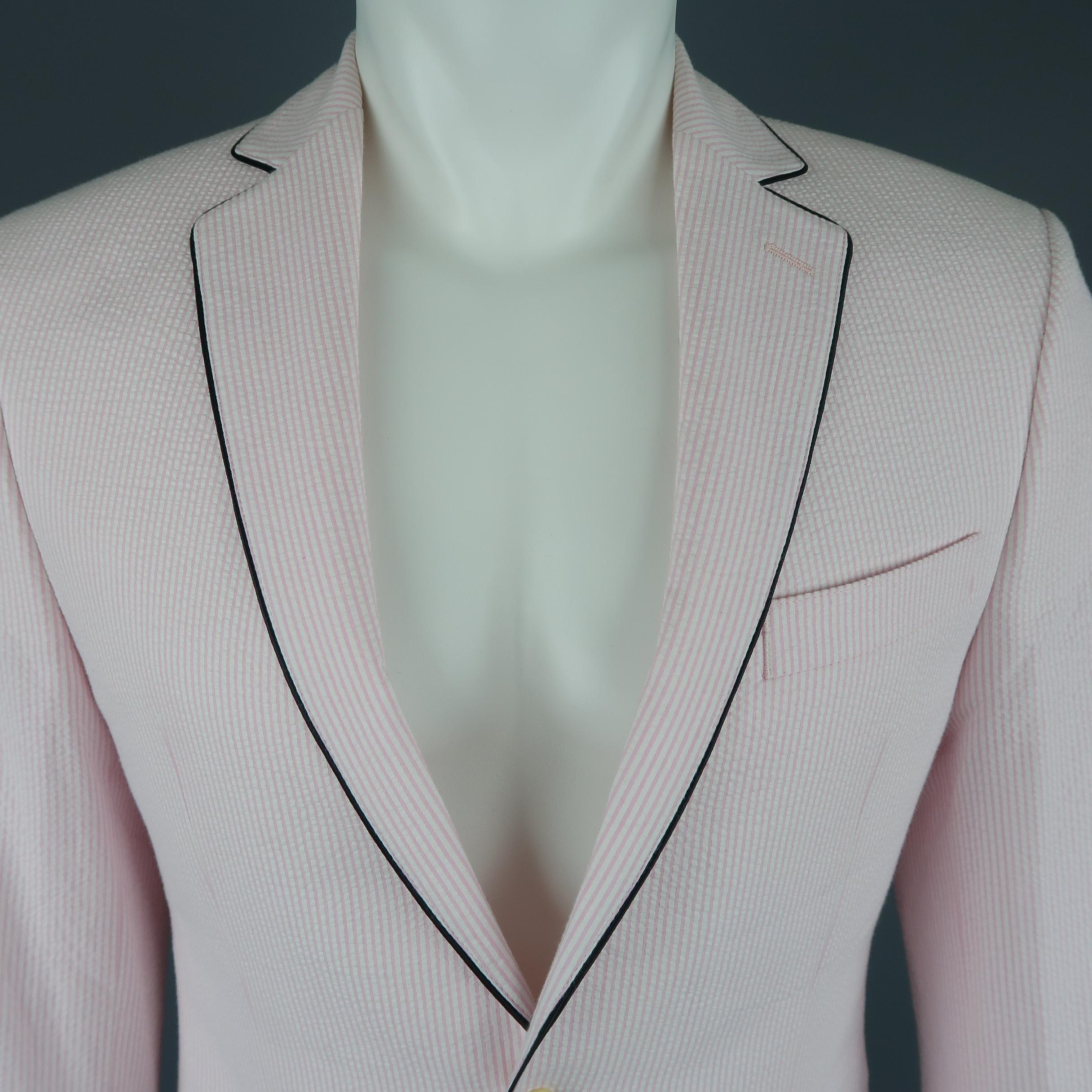 Single breasted TALLIA sport coat jacket come sin pink striped seersucker with a two button front, black piping, and notch lapel.
 
New with Tags.
Marked: 36 R
 
Measurements:
 
Shoulder: 17 in.
Chest: 40 in.
Sleeve: 24 in.
Length: 29 in.