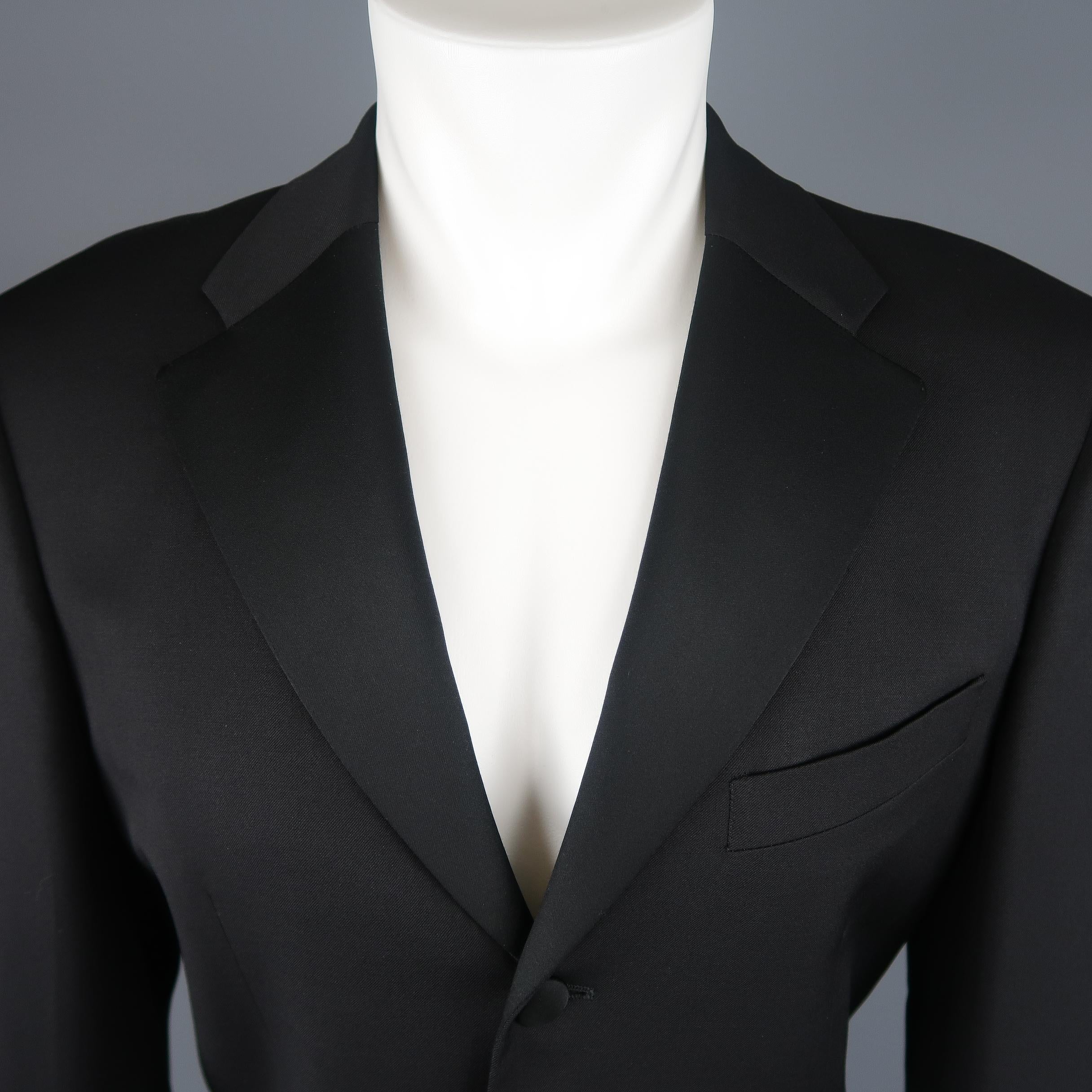 Single breasted VALENTINO sport coat tuxedo jacket comes in black wool twill with a half satin notch lapel, three button front with satin buttons, and ventless back. Made in Italy.
 
Excellent Pre-Owned Condition.
Marked: IT 48
 
Measurements:
