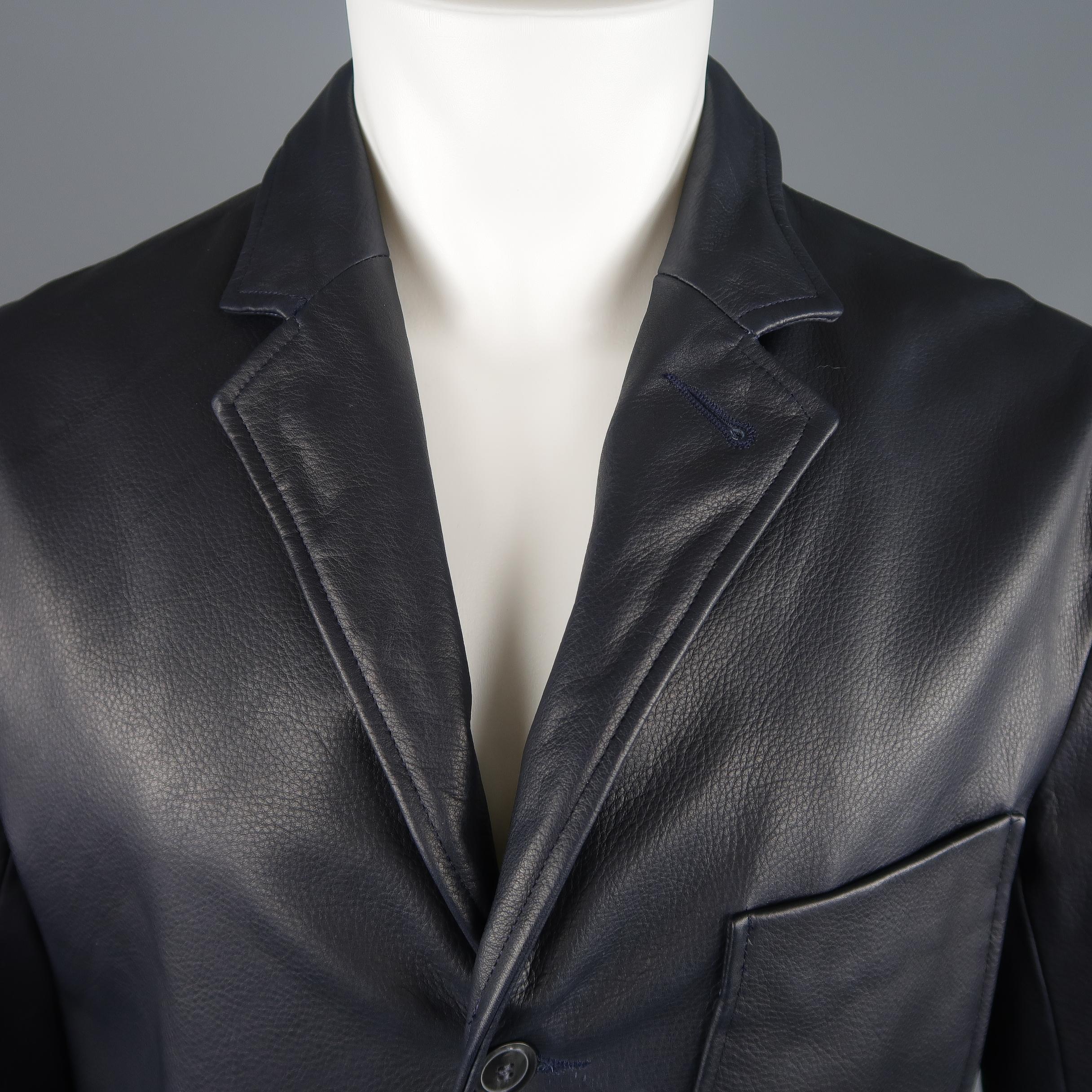 UNIONMADE X GOLDEN BEAR jacket comes in navy textured leather with a notch lapel, three button front, and patch pockets. Made in USA.
 
Excellent Pre-Owned Condition.
Marked: L
 
Measurements:
 
Shoulder: 20 in.
Chest: 46 in.
Sleeve: 26 in.
Length: