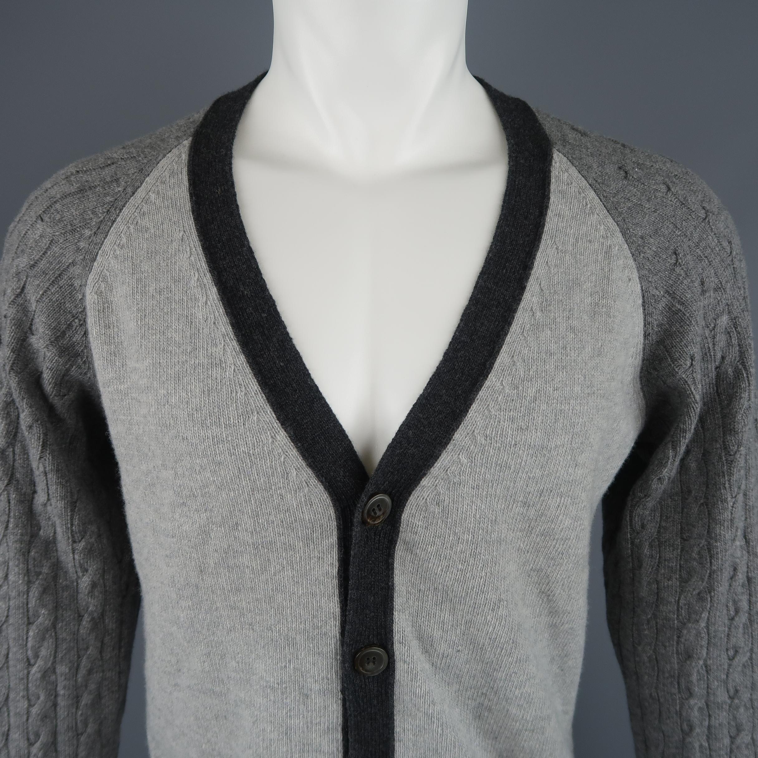 OFFICINE GENERALE color block cardigan comes in a wool cashmere blend knit with a V neck, light bray body, charcoal trim, and heather gray cable knit raglan sleeves. Made in Italy.
 
Excellent Pre-Owned Condition.
Marked: M
 
Measurements:
