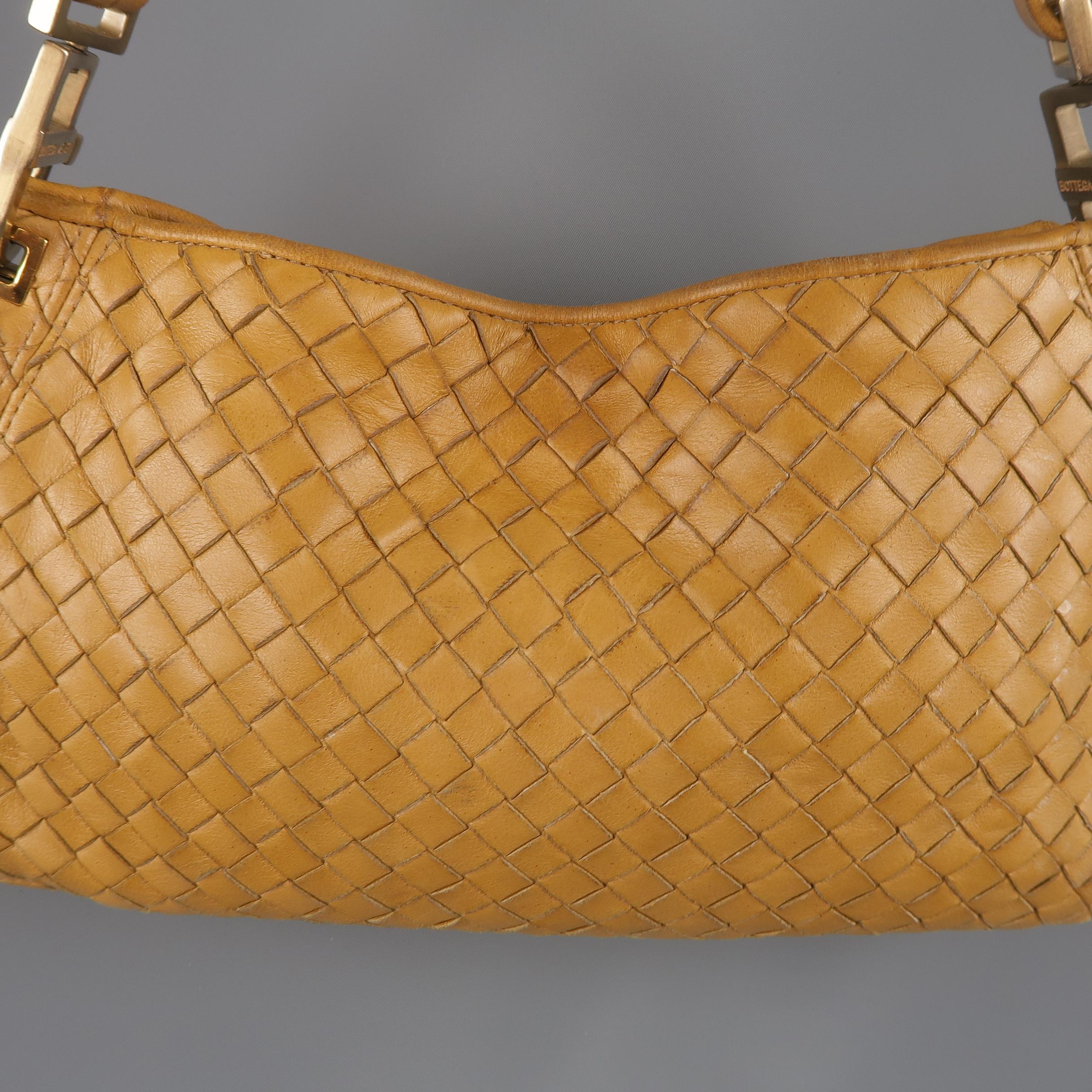 Vintage BOTTEGA VENETA shoulder bag comes in golden yellow Intrecciato woven leather with a detachable shoulder strap and snap top closure. Wear throughout leather and liner and strap damaged. As-is. Made in Italy.
 
Fair Pre-Owned Condition.

