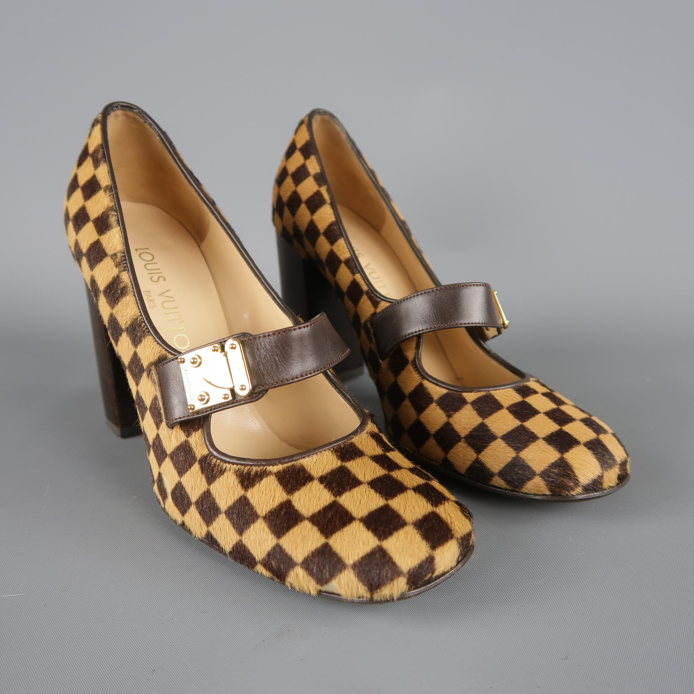 Fabulous statement pumps by Louis Vuitton. A retro inspired style in gorgeous tan and chocolate brown Damier checkered pony hair featuring a rounded square toe, thick chocolate brown leather Mary Jane strap with gold tone decorative LV engraved