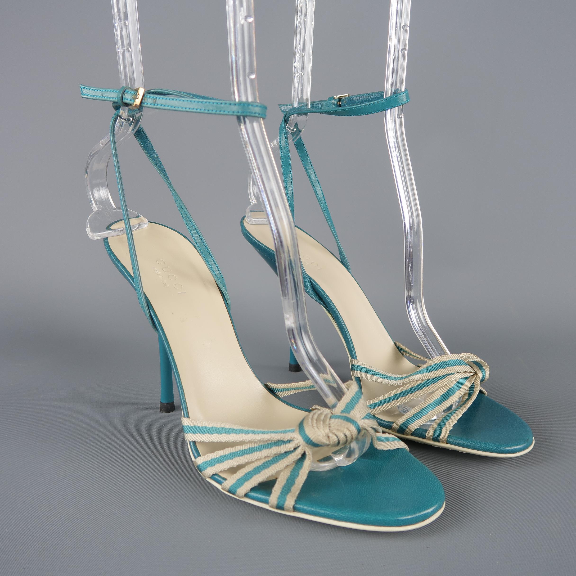 GUCCI sandals come in teal leather with a lacquered  stiletto heel, beige striped knotted silk ribbon toe strap, and wrapped ankle strap. Only tried on. With Box. Made in Italy.
 
New with Box.
Marked:IT 37.5
 
Measurements:
 
Heel: 4.5 in.