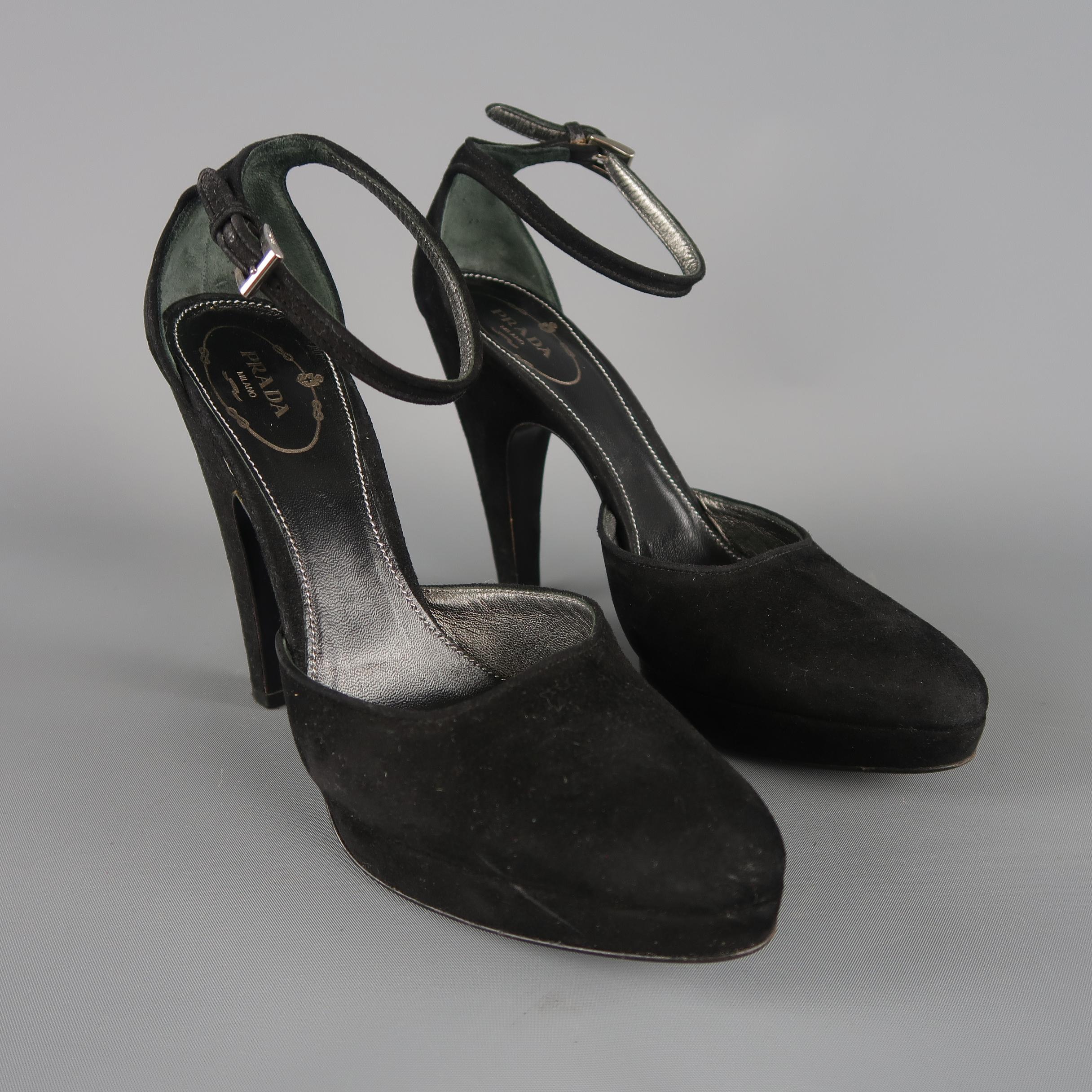 PRADA pumps come in black suede with a pointed toe, covered platform, ankle strap, and covered retro heel. Made in Italy.
 
Good Pre-Owned Condition.
Marked: IT 37.5
 
Measurements:
 
Heel: 4.5 in.
Platform: 0.5 in.