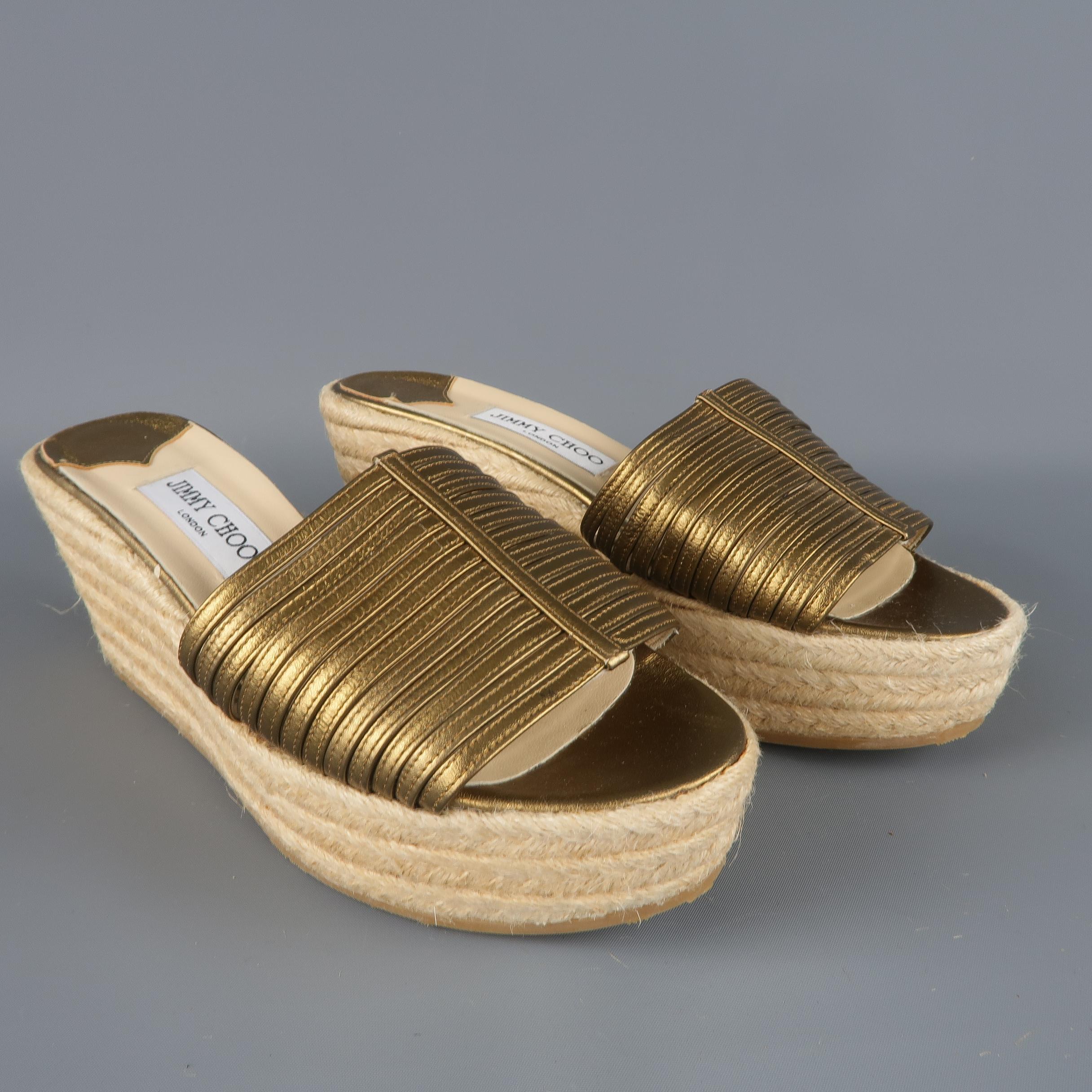 JIMMY CHOO sandals feature metallic gold leather strappy toe strap and braided espadrille platform wedge sole. New without Tags. Made in Italy.
 
Excellent Pre-Owned Condition.
Marked: IT 40
 
Measurements:
 
Heel: 2.75 in.
Platform: 1.5 in.