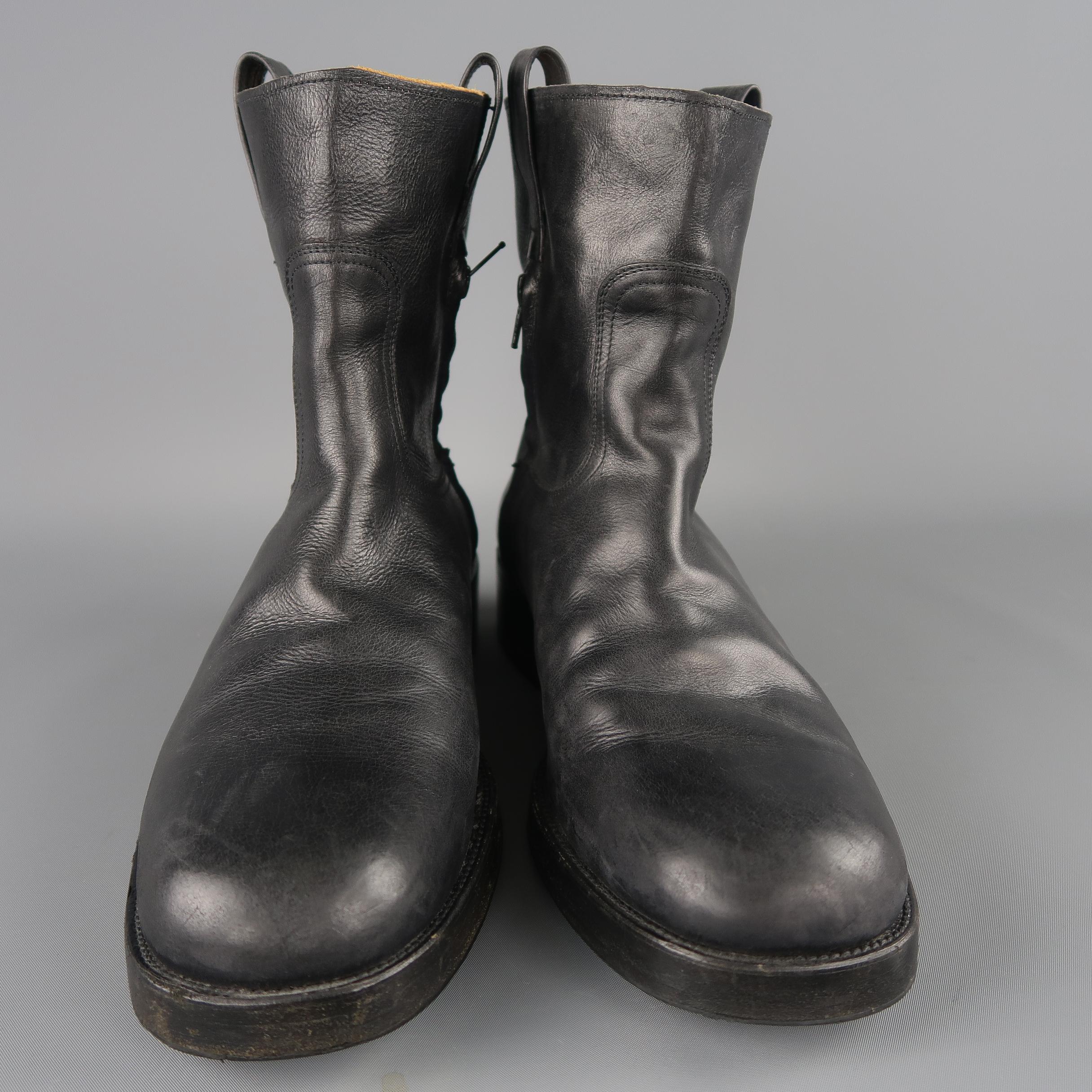 Maison Martin Margiela  pull on biker style boots come in black leather with a rounded square toe, thick chunky heeled sole, and internal half zip. Made in Italy.
 
Good Pre-Owned Condition.
Marked:IT 44
 
Measurements:
 
Length: 7.5 in.