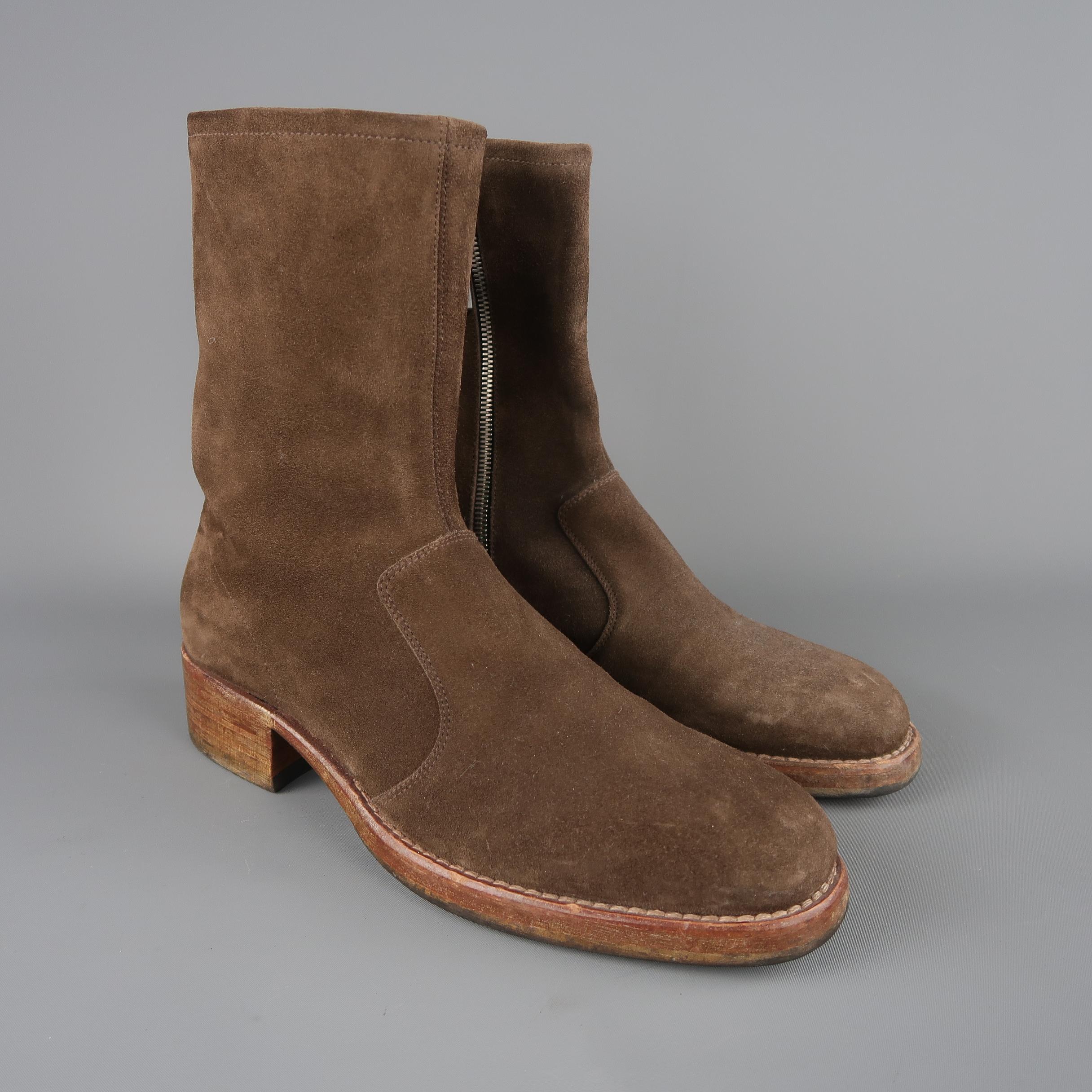 Maison Martin Margiela ankle boots come in brown suede with a squared round toe, inner zip closure, and distressed brick colored heeled, stacked sole. Made in Italy.
 
Good Pre-Owned Condition.
Marked: IT 43
 
Measurements:
 
Length: 8.5 in.