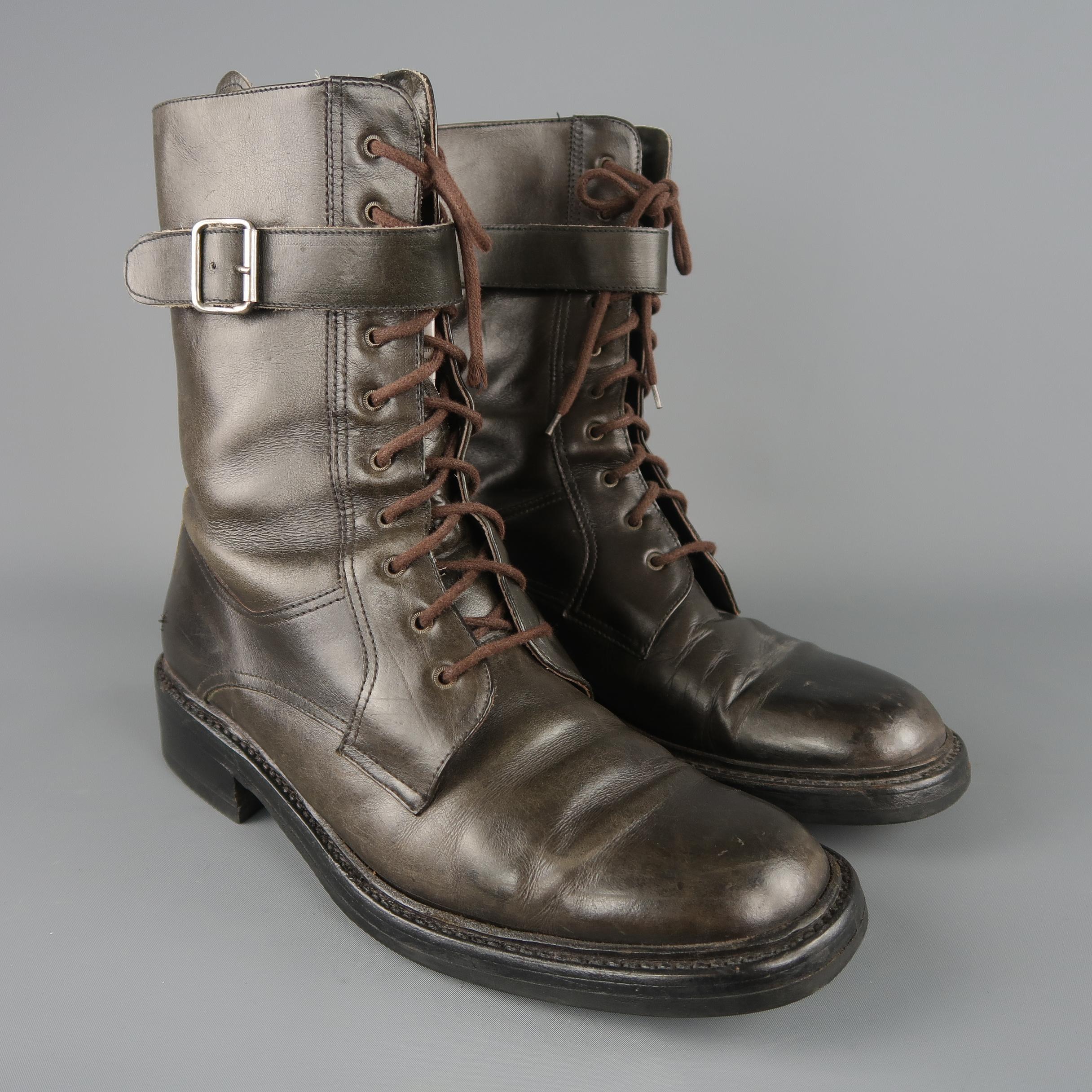 Prada combat style boots come in taupe leather with a rounded square toe, lace up front, stacked heeled sole, and buckled ankle strap. Logos worn of. Made in Italy.
 
Good Pre-Owned Condition.
Marked: (no size)
 
Measurements:
 
Length: 9 in.