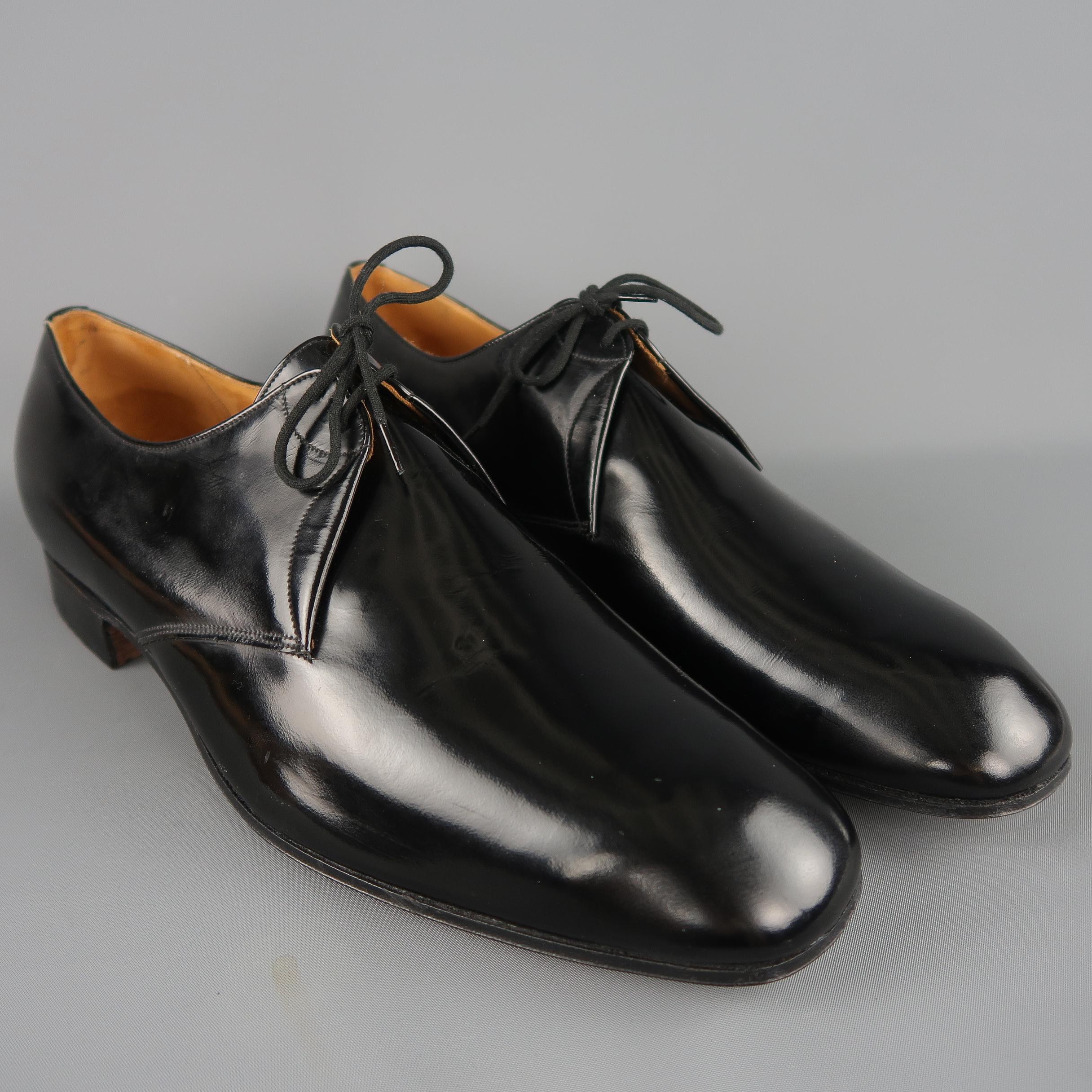 CHURCH'S derby dress shoes come in black patent leather with a tapered square toe. With shoe trees. Made in England.
 
New with Tags.
Marked: 13 D