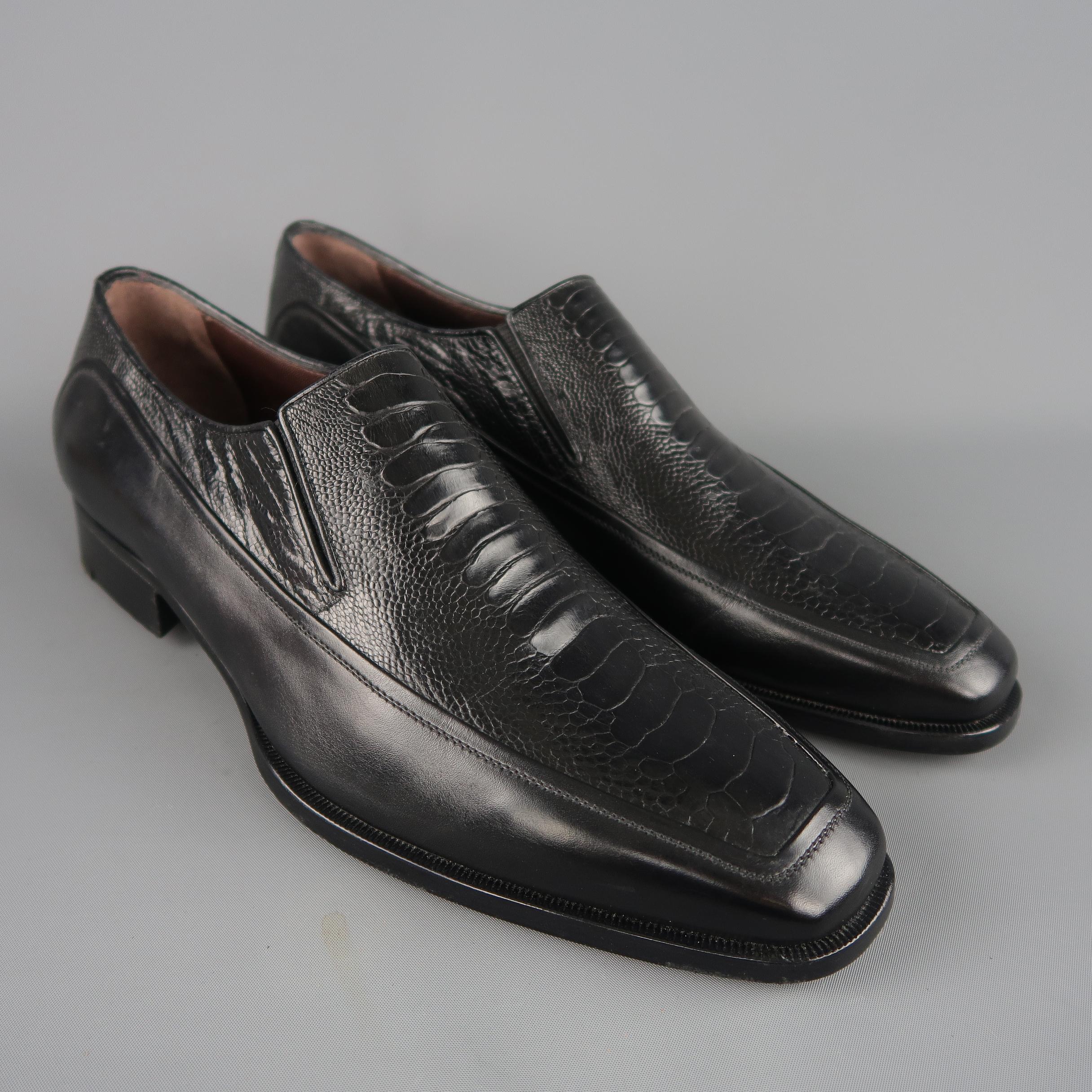 A.Testoni dress loafers come in smooth black leather with a tapered square apron toe and lizard textured leather upper panel. Made in Italy. Brand New.
Marked: UK 7.5