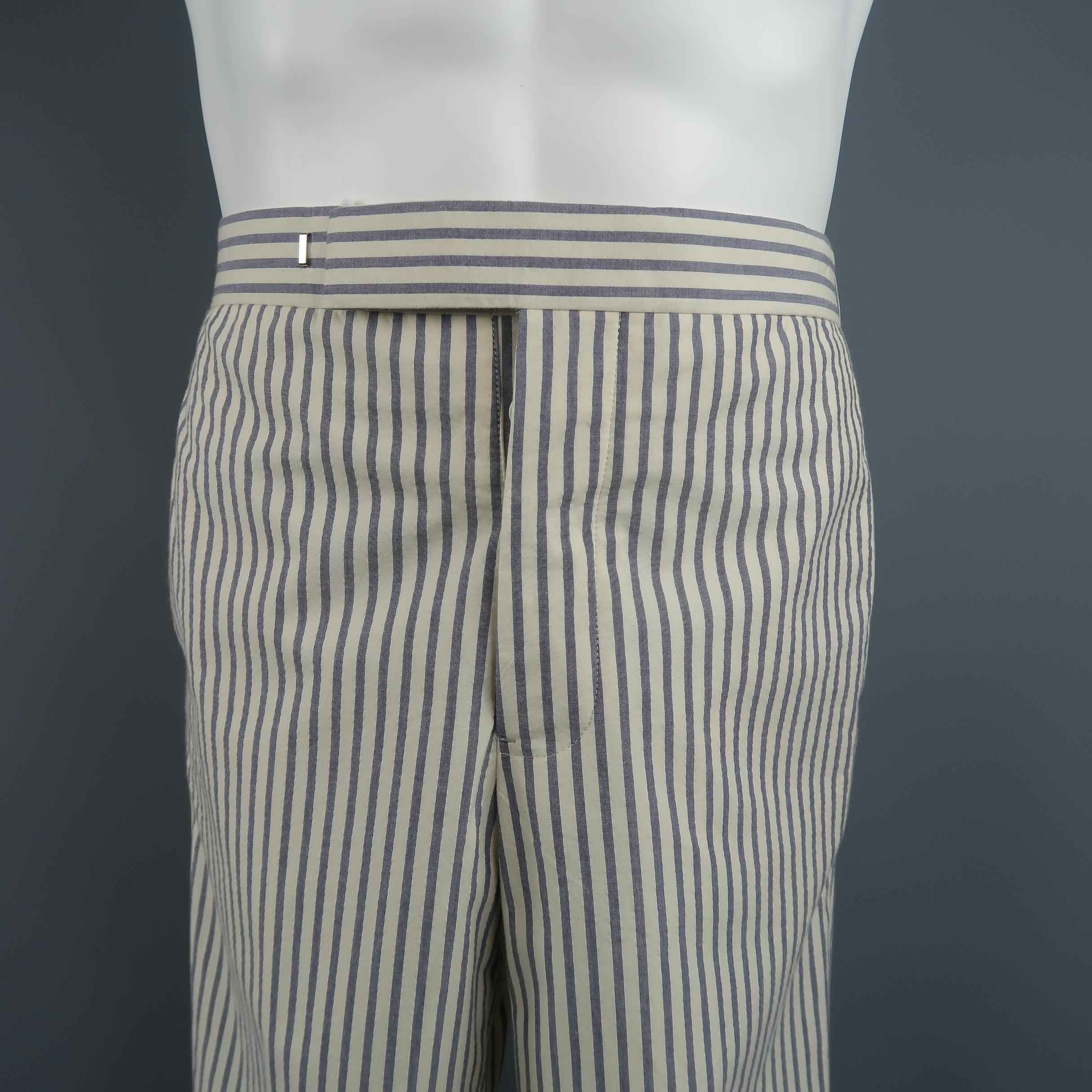 Black Fleece  pants, come in light weight stripe cotton, with a classic tailoring closure and cuffed hem.
 
Excellent Pre-Owned Condition.
Marked: BB0
 
Measurements:
 
Waist: 30 in.
Rise: 11 in.
Inseam: 29 in.