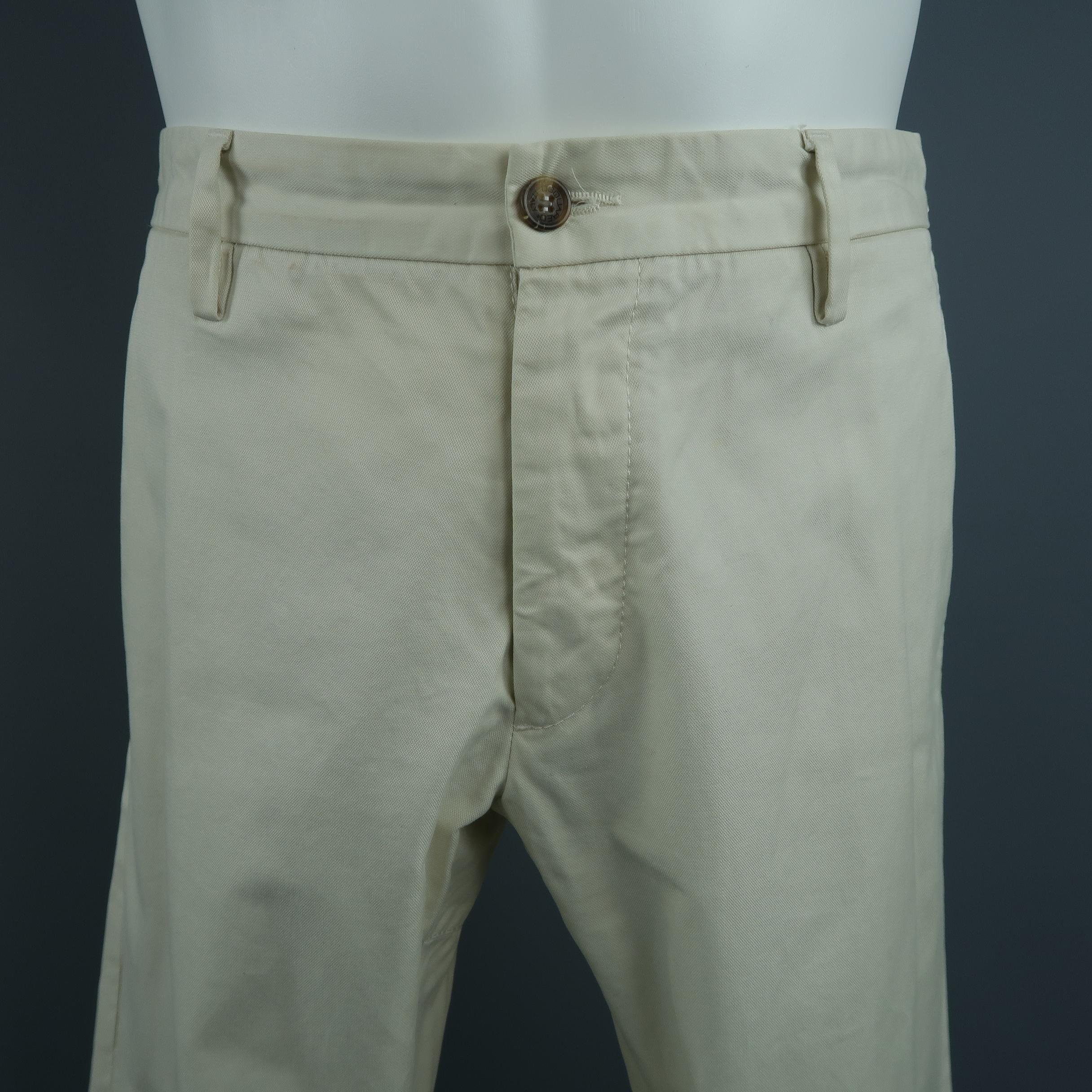 DSQUARED2 Casual pants, come in solid cream cotton with patch details on the back and side tabs. Made in Italy.
 
Fair Pre-Owned Condition, with small stains.
Marked: IT 48
 
Measurements:
 
Waist: 35 in.
Rise: 9 in.
Inseam:  31 in,