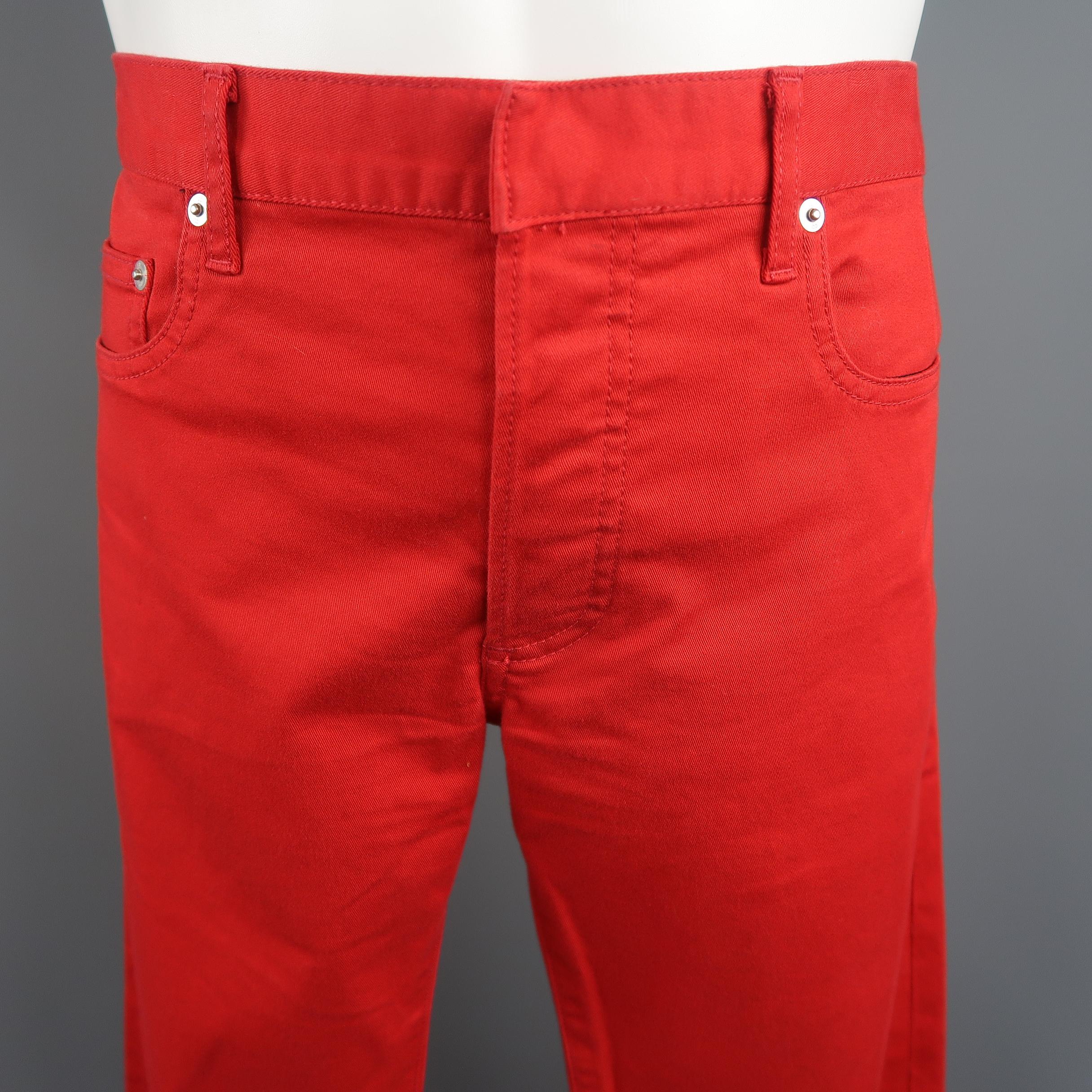 Dior Homme Jeans come in red solid cotton blend denim with a silver tone logo detail and button fly closure. Made in Japan.
 
Excellent Pre-Owned Condition.
Marked: 32
 
Measurements:
 
Waist: 36 in.
Rise: 9 in.
Inseam: 29 in.