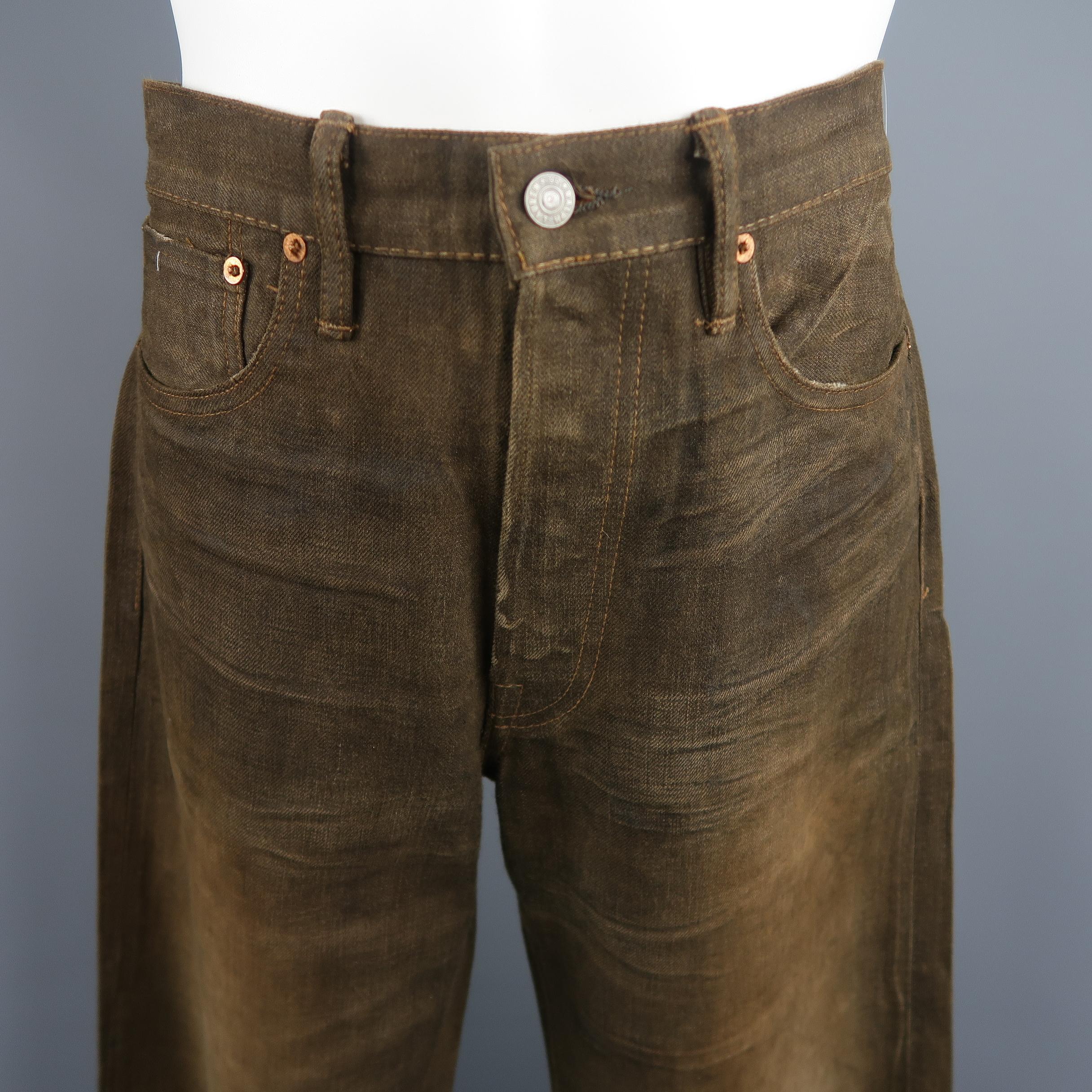 RRL by Ralph Lauren jeans come in brown selvage denim with all over washed distressing, button fly, and relaxed straight leg fit. Made in USA.
 
Good Pre-Owned Condition.
Marked: 32 x 32
 
Measurements:
 
Waist: 34 in.
Rise: 12 in.
Inseam: 32 in.