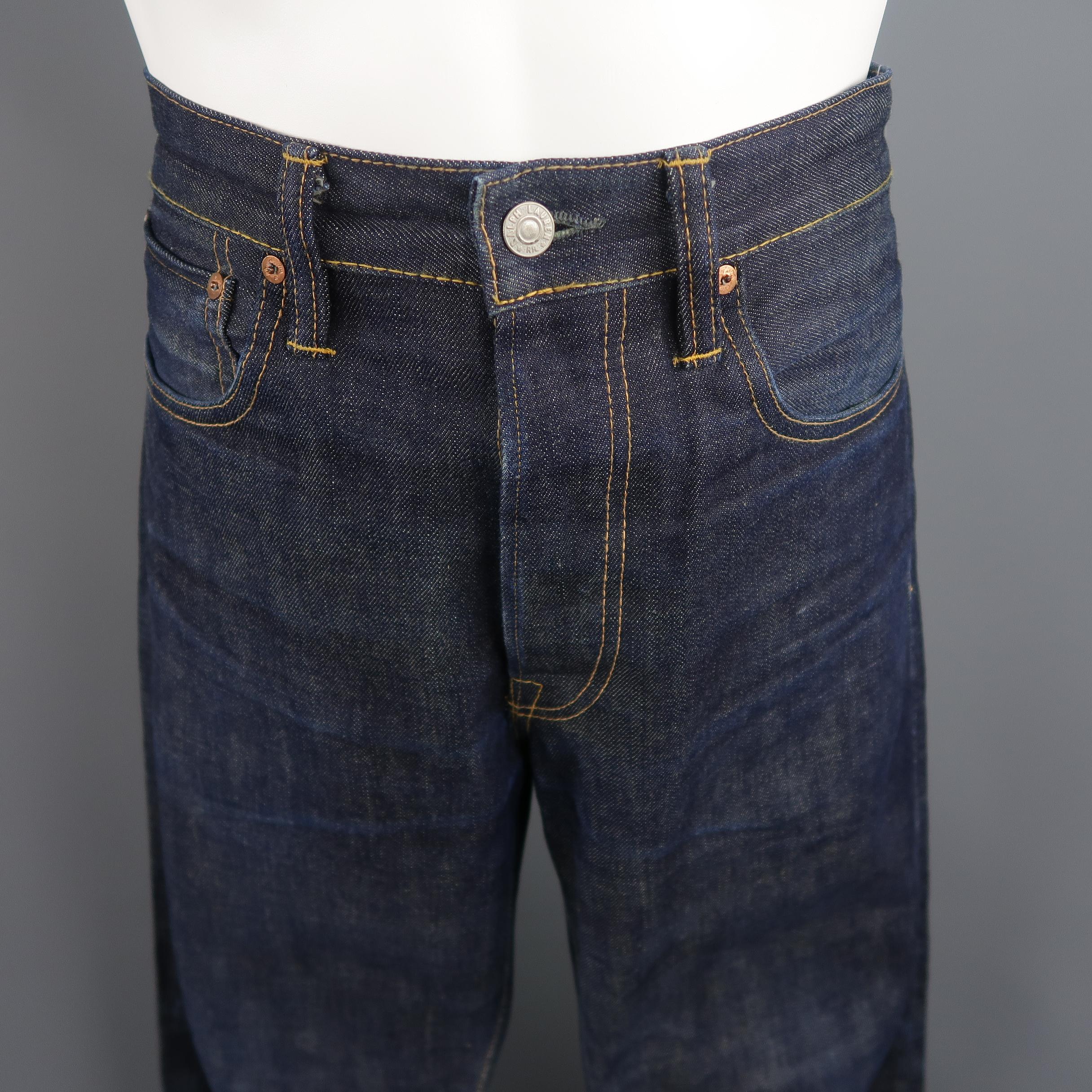 RRL by RALPH LAUREN jeans come in perfectly broken in indigo raw selvage denim with a classic fit and yellow contrast stitching. As-is.  Made in USA.
 
Fair Pre-Owned Condition.
Marked: 32 X 32
 
Measurements:
 
Waist: 34 in.
Rise: 10 in.
Inseam: 